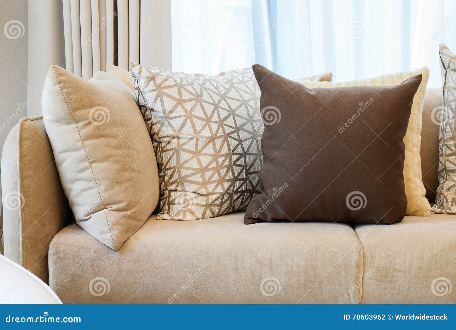 Sy Brown Tweed Sofa With Grey Patterned Pillows Stock