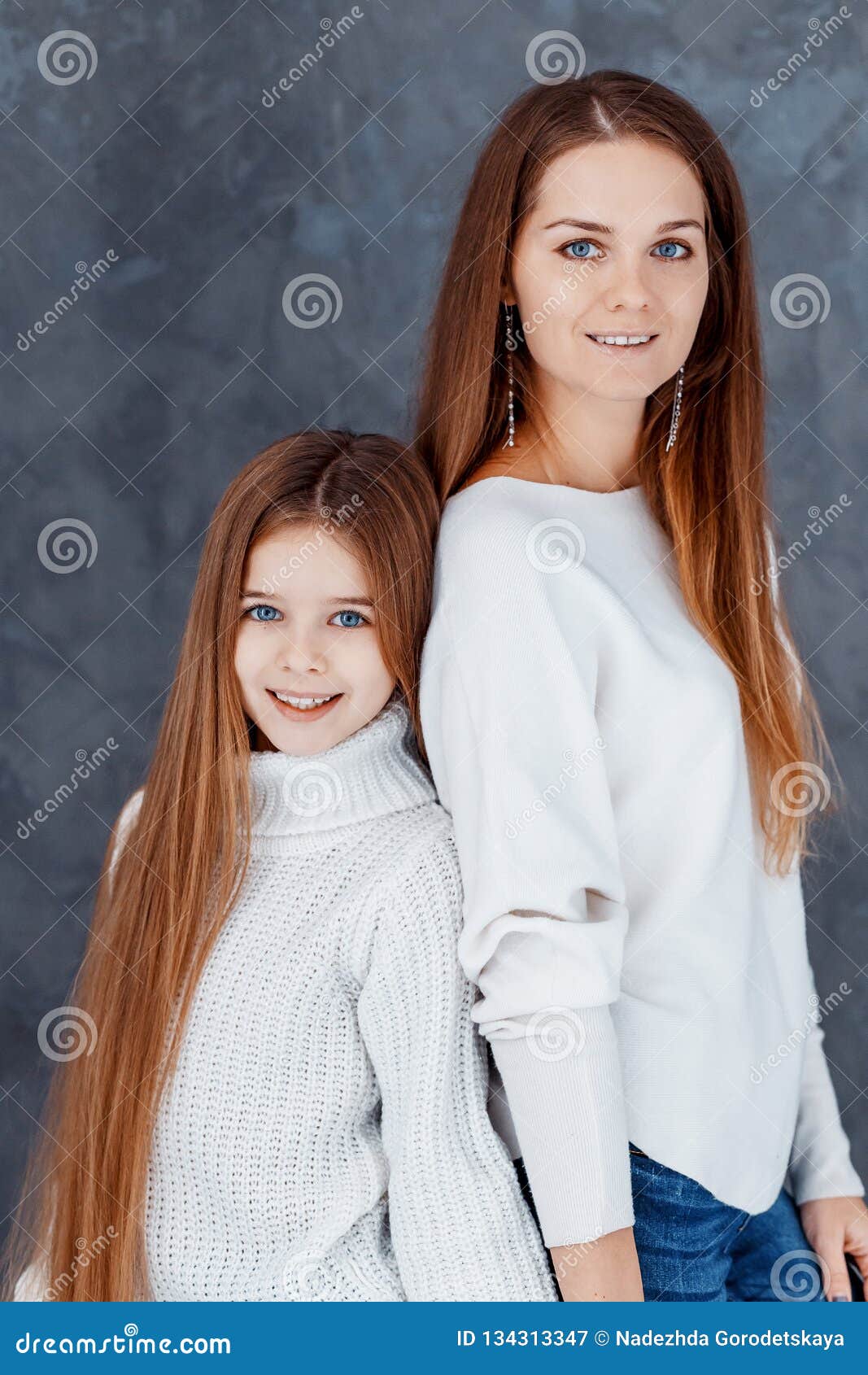 Beautiful Mother And Daughter Studio Shot Stock Photo - Image of company, relationship: 123684140