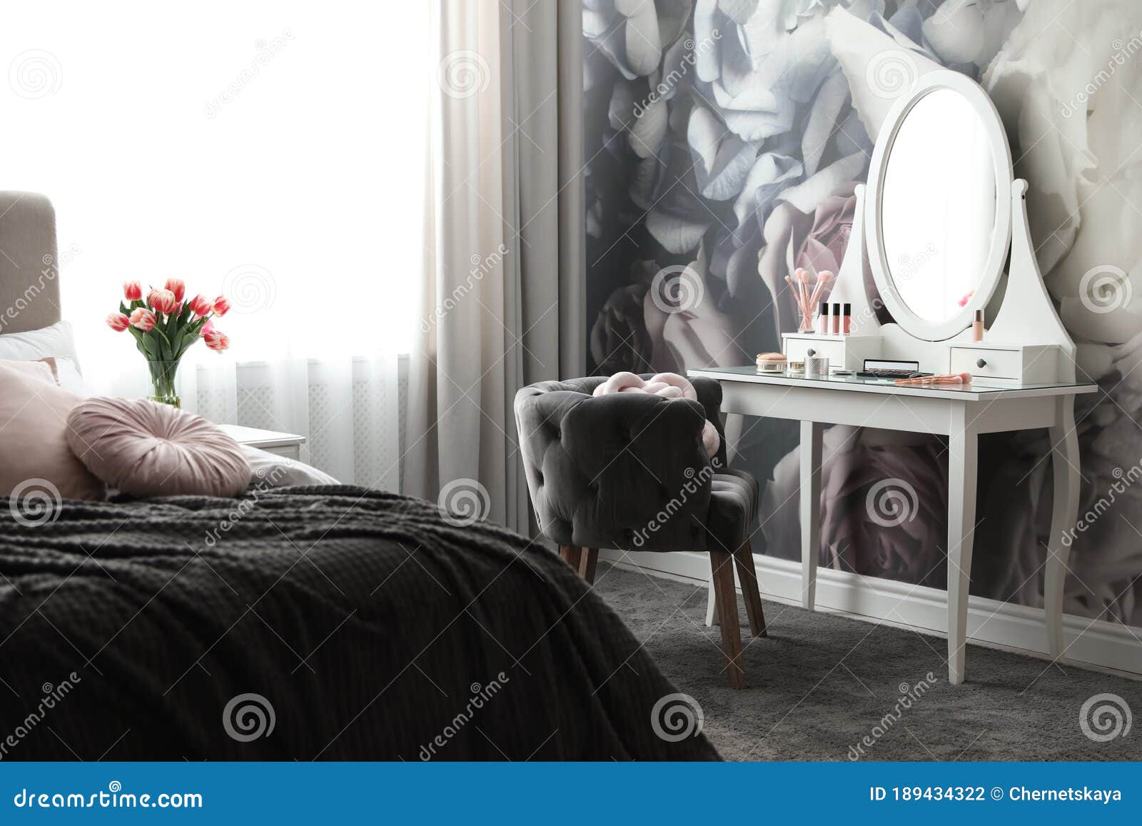 Bedroom Interior with Elegant Dressing Table and Floral Wallpaper Stock