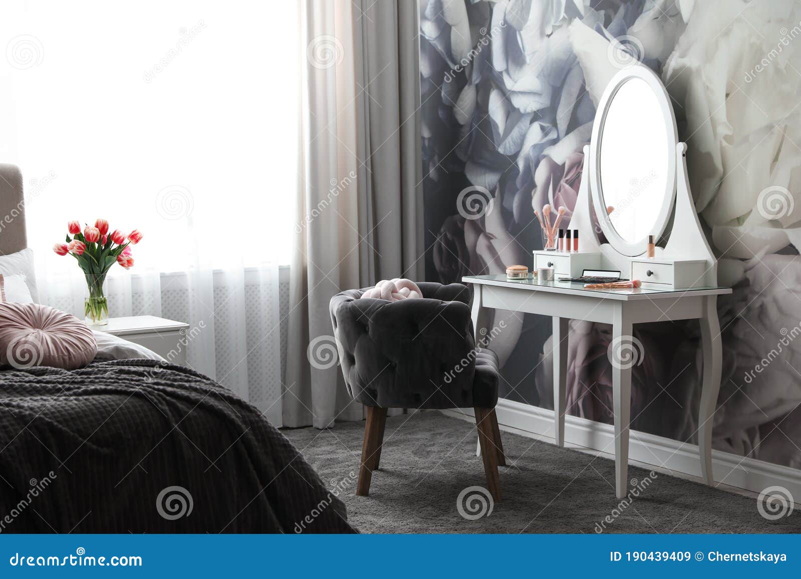 Bedroom Interior with Elegant Dressing Table and Floral Wallpaper Stock