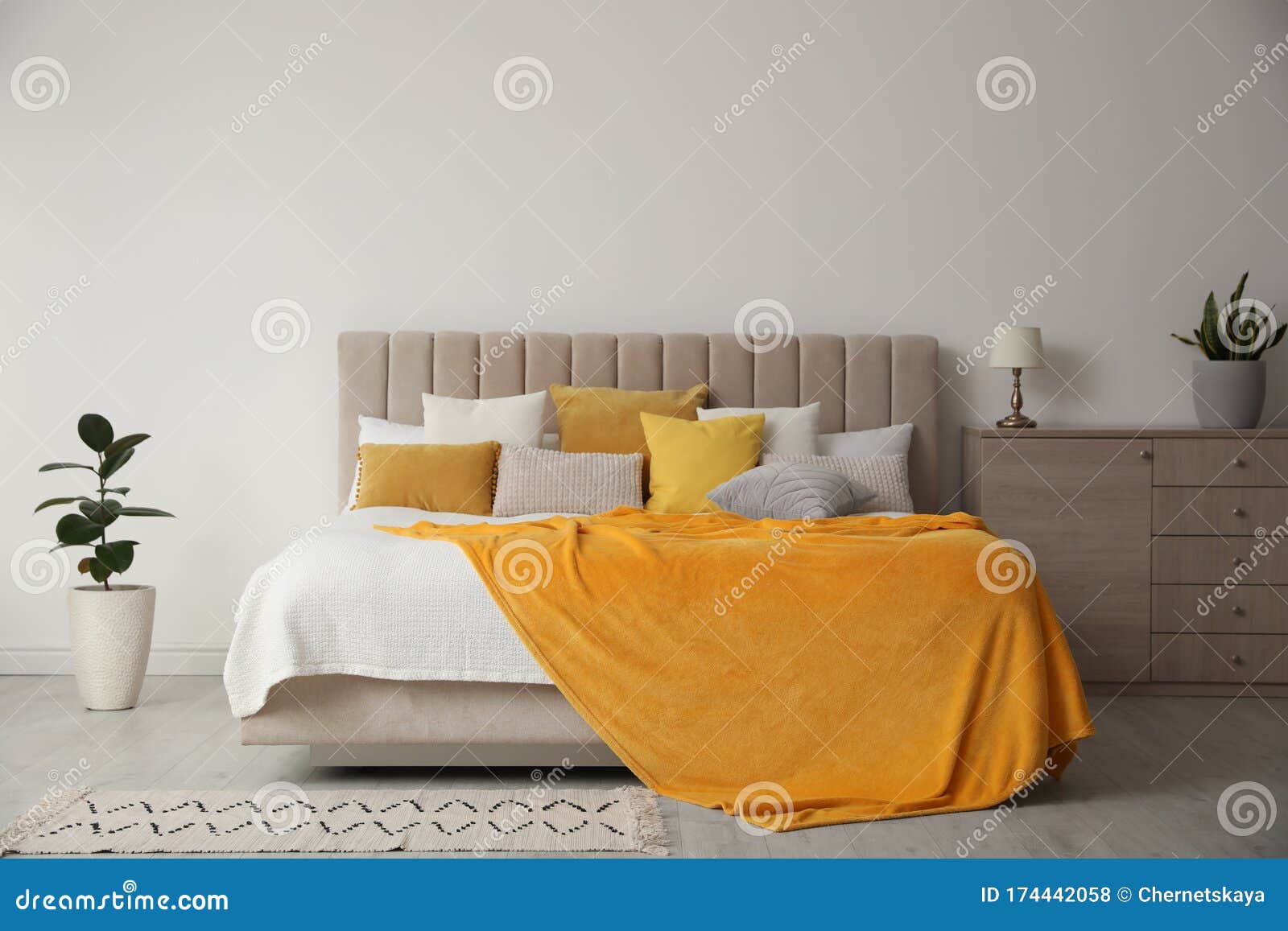 Stylish Bedroom Interior with Soft Yellow Pillows and Blanket Stock Photo Image of decorative