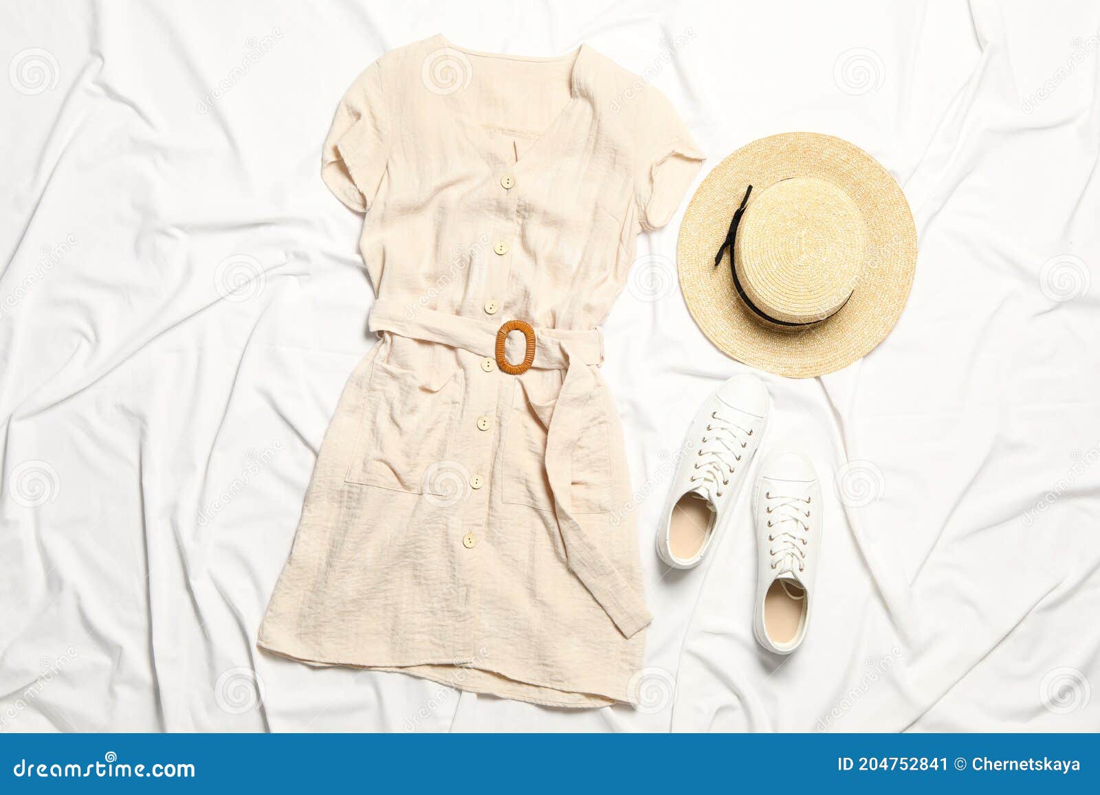 Stylish Beige Dress, Shoes and Hat on White Fabric, Flat Lay Stock ...