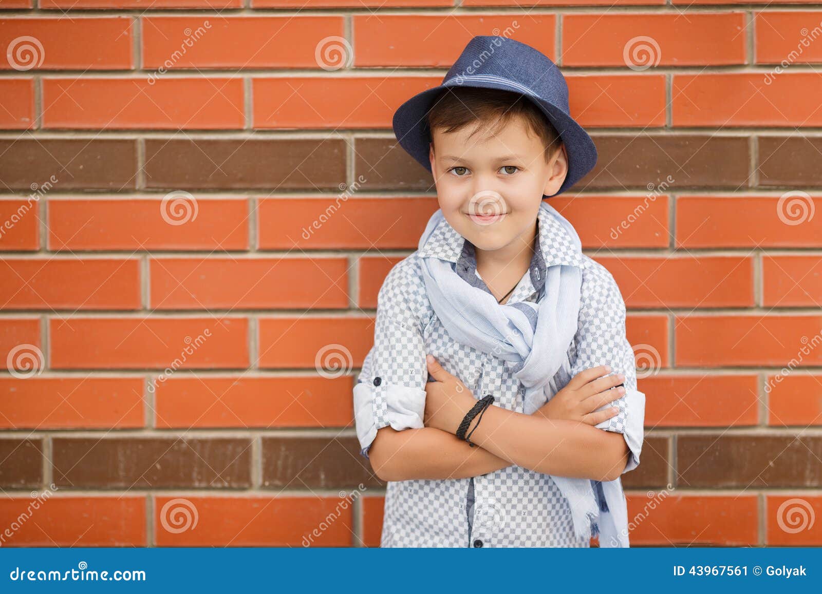 Stylish Boy in Hat Posing on a Brick Wall Stock Image - Image of ...