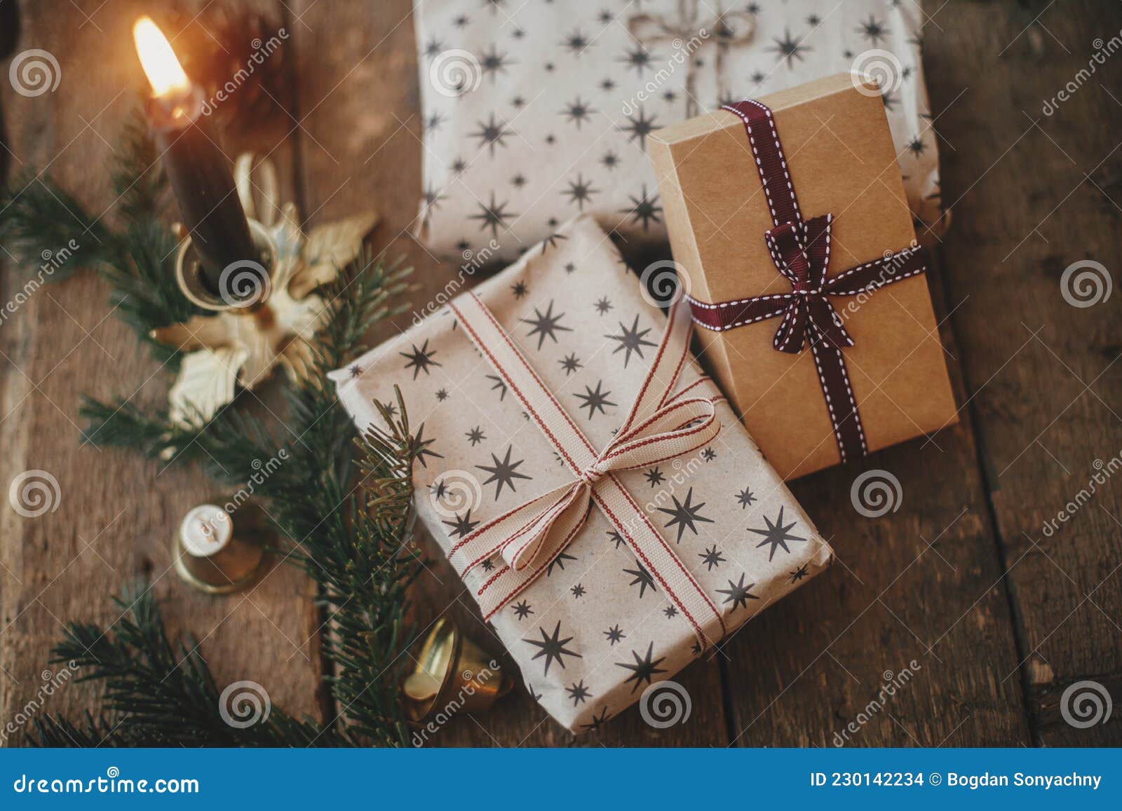 Christmas rustic flat lay. Stylish christmas gift box, wrapping paper,  wooden reindeer Stock Photo by Sonyachny