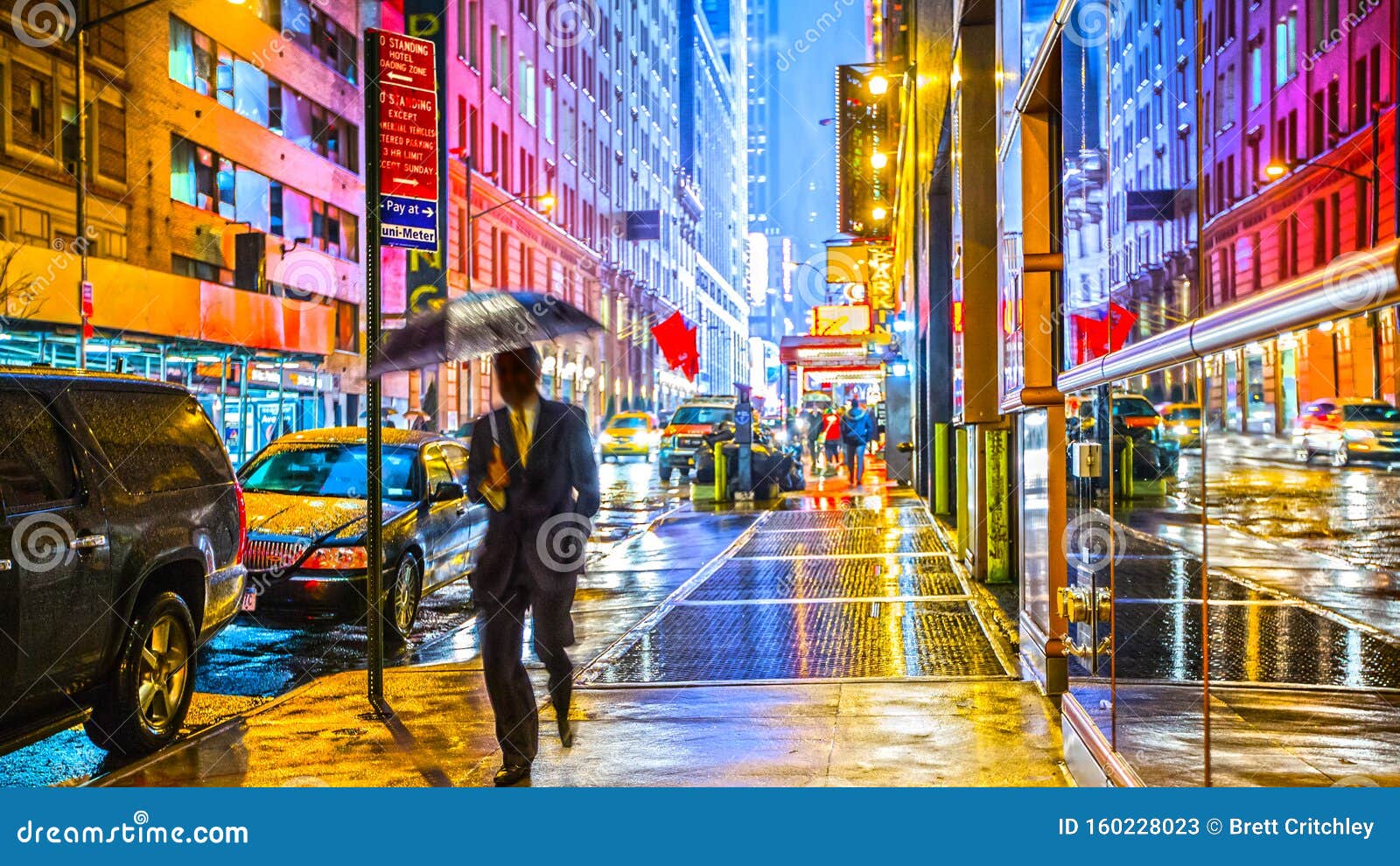 stylish colorful wet new york nyc commuter with umbrella