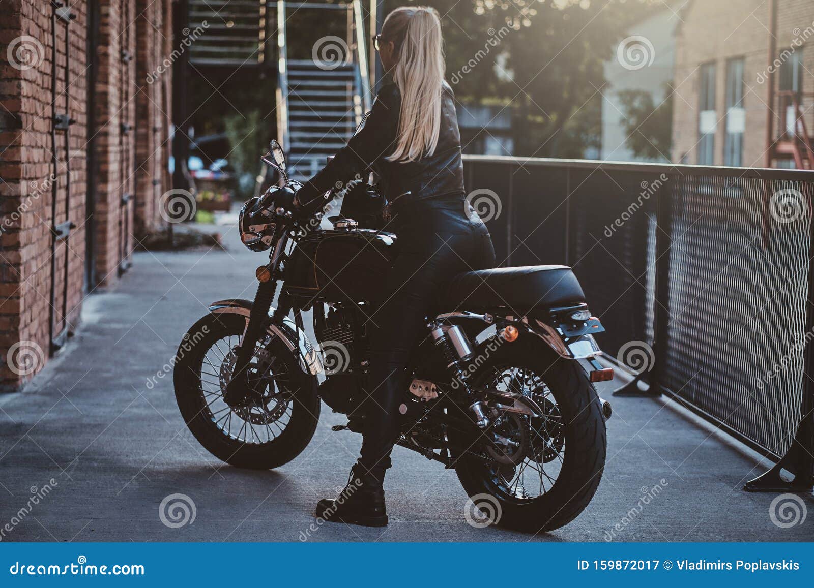 Woman on red motorcycle stock image. Image of rider 