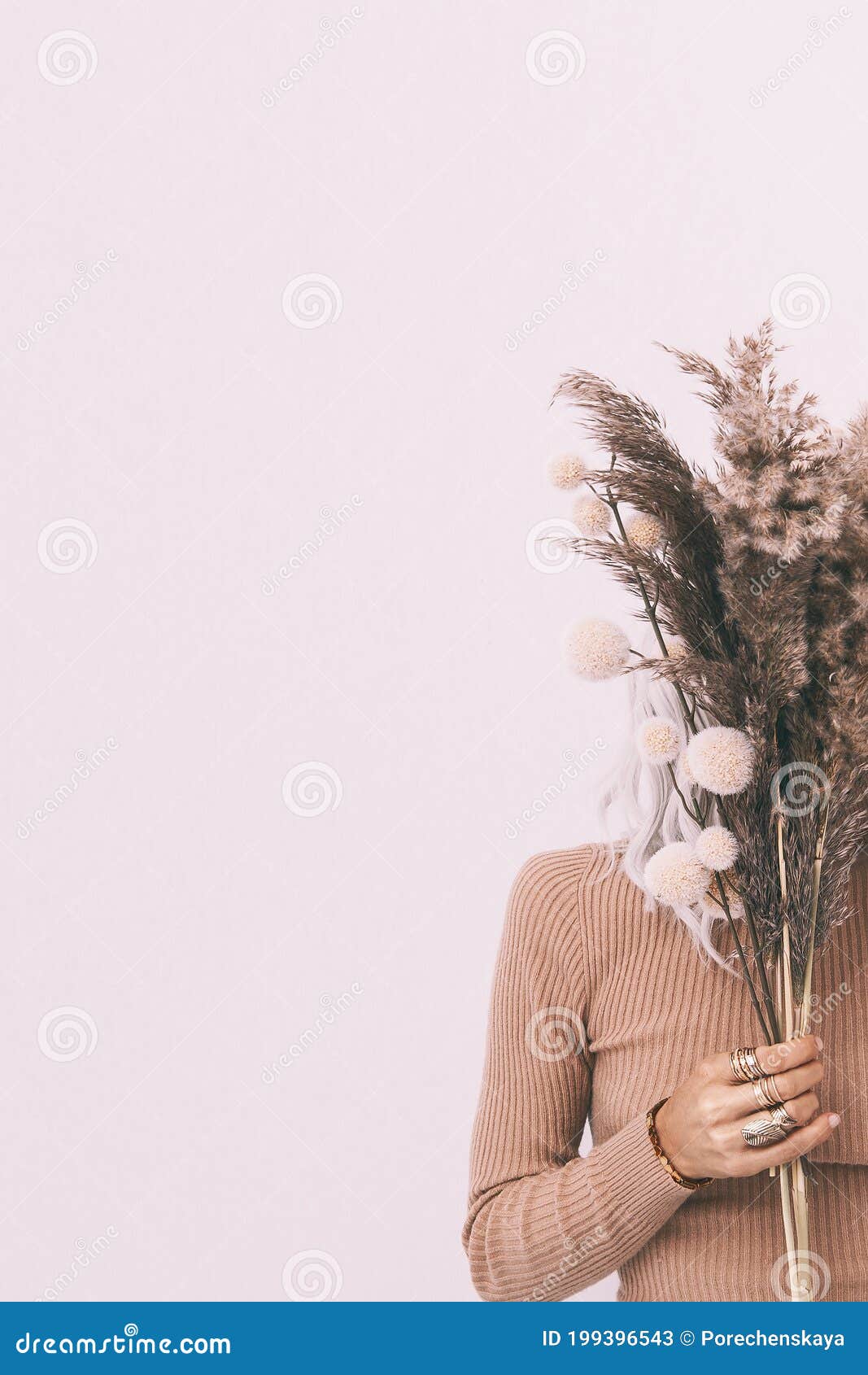 Stylish Girl with Autumn Decor Bouquet.in White Space. Minimal