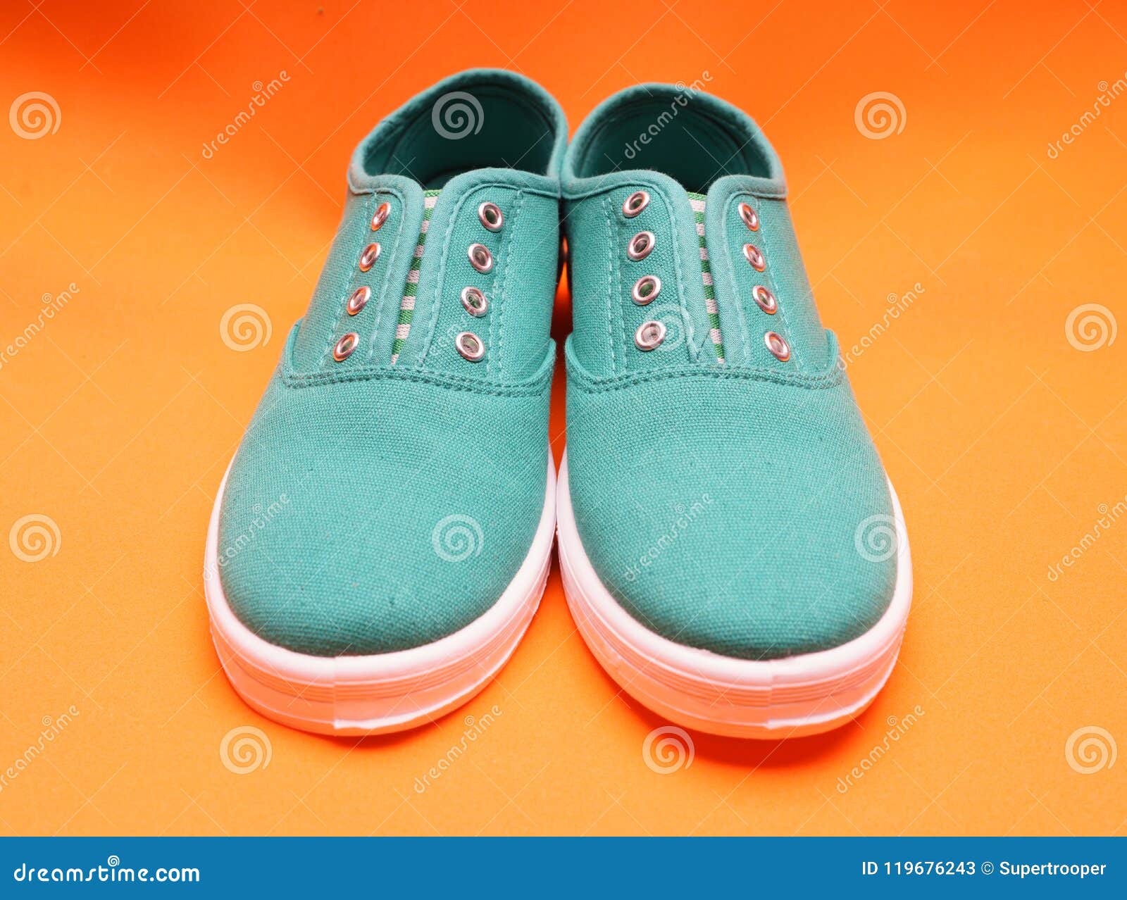 Green Sneakers on Orange stock image. Image of shoe - 119676243