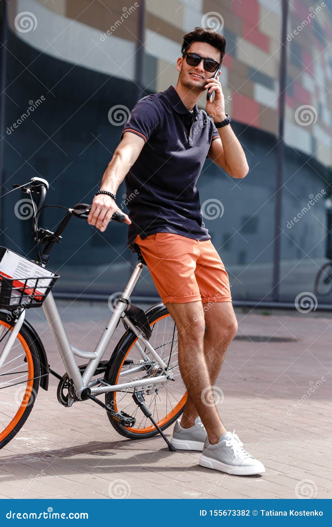 Stylish Guy Dressed in Trendy Casual Clothes Rides Bicycle in the ...