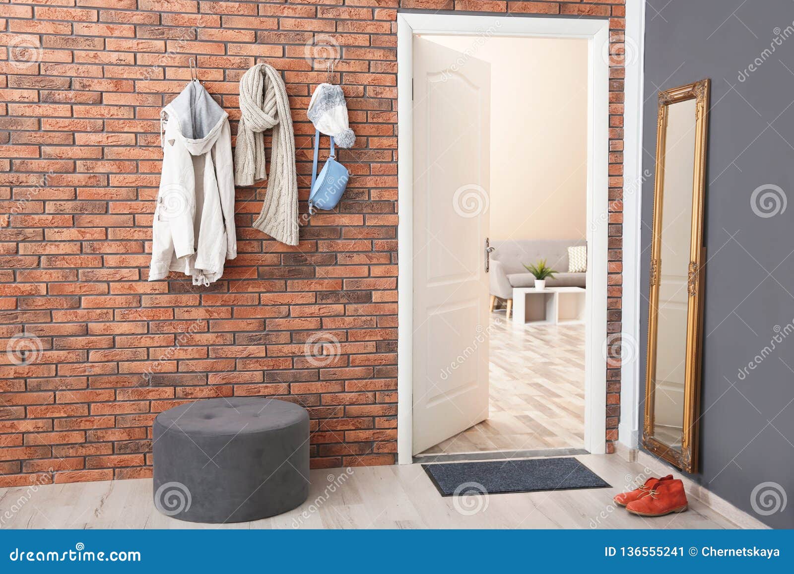 Stylish Hallway Interior With Door And Clothes Hanging Stock