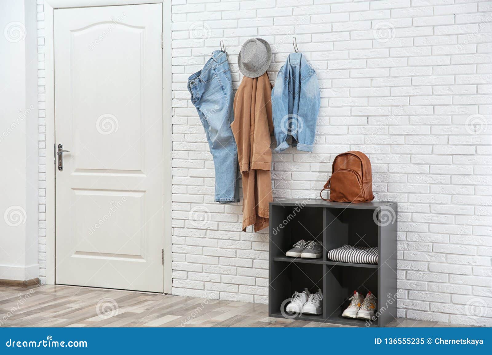Stylish Hallway Interior With Door Shoe Rack And Clothes