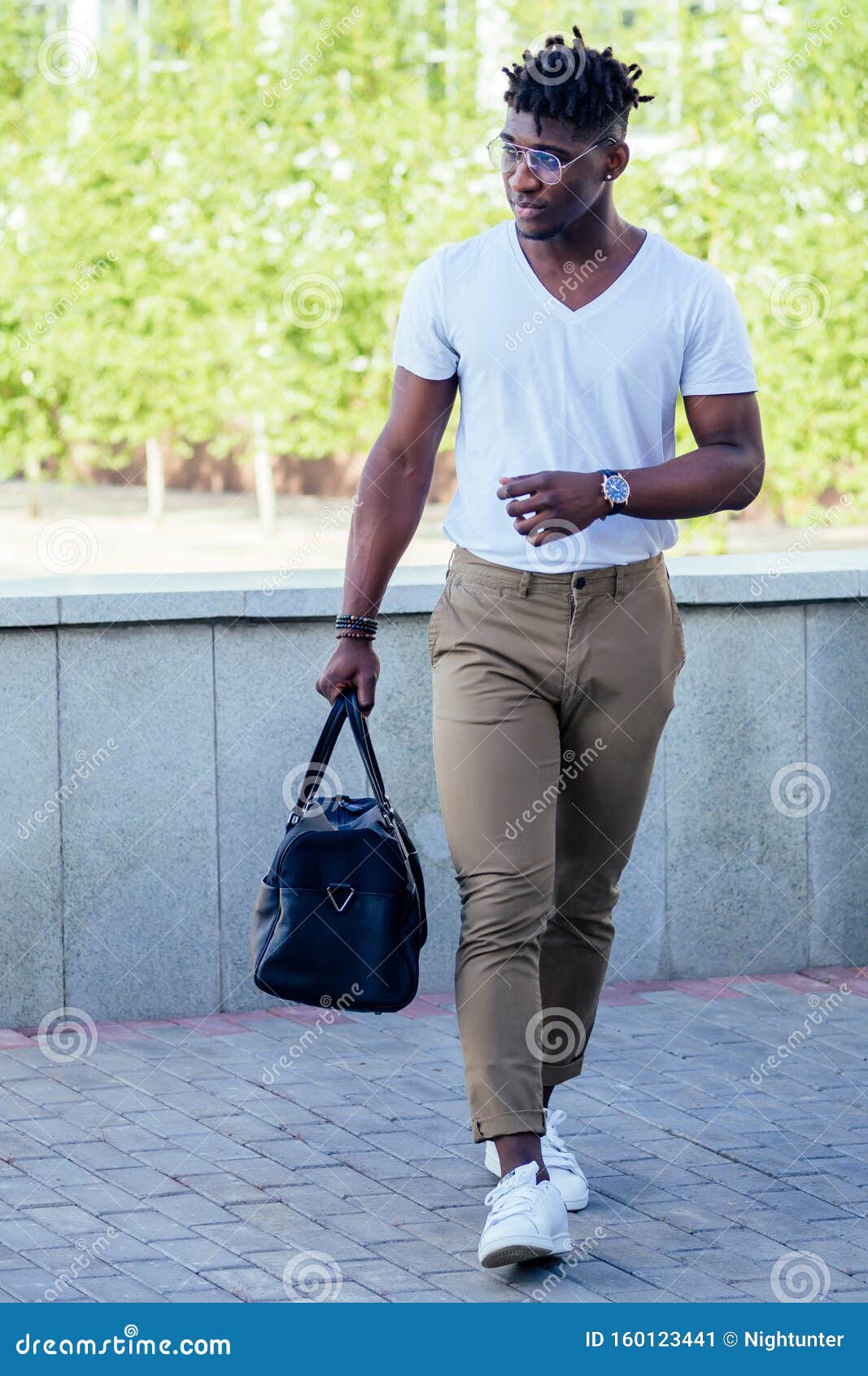 Stylish and Handsome African American Man with Cool Dreadlocks in Brown ...
