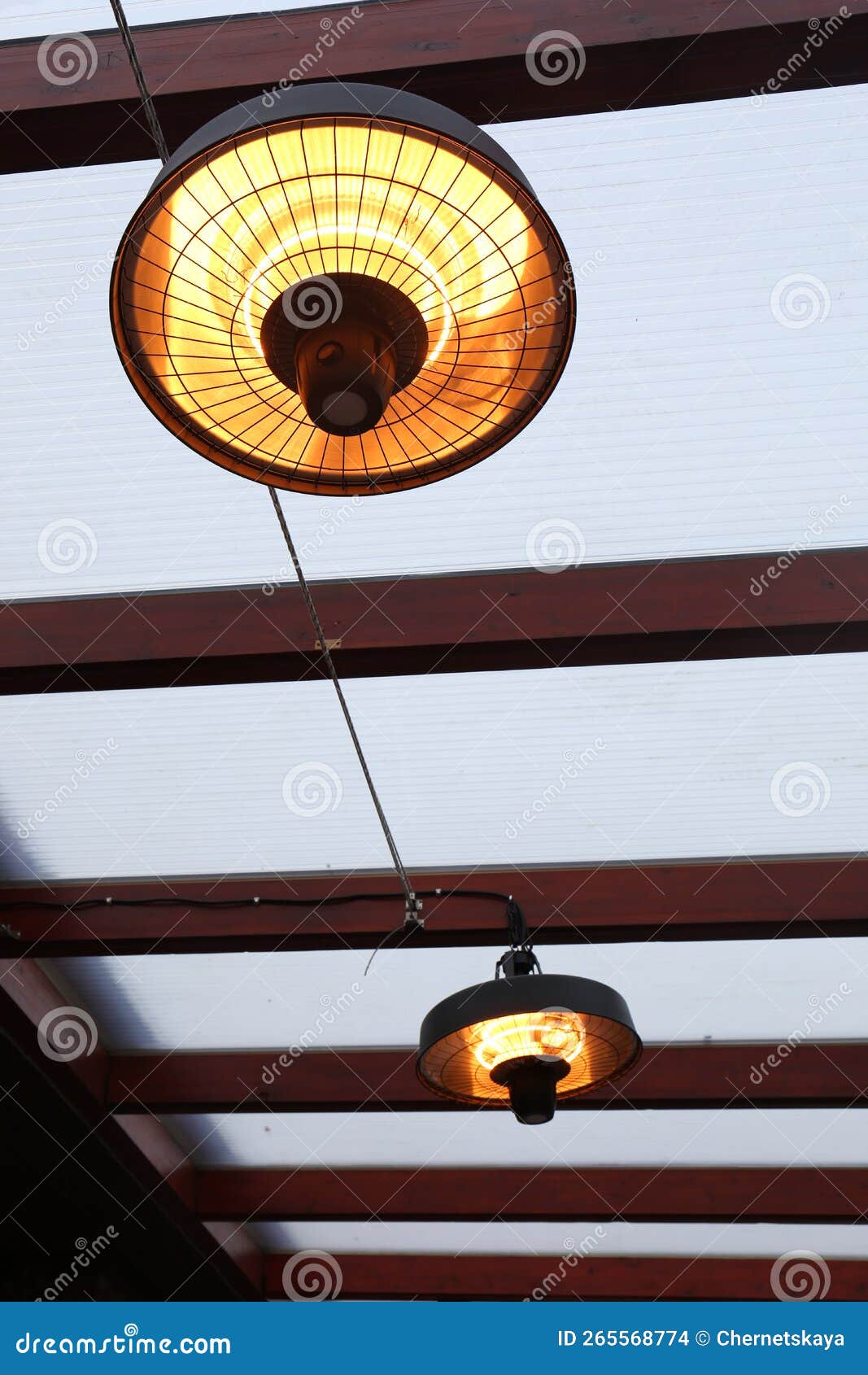Stylish Hanging Infrared Heaters on Terrace Indoors Stock Photo Image