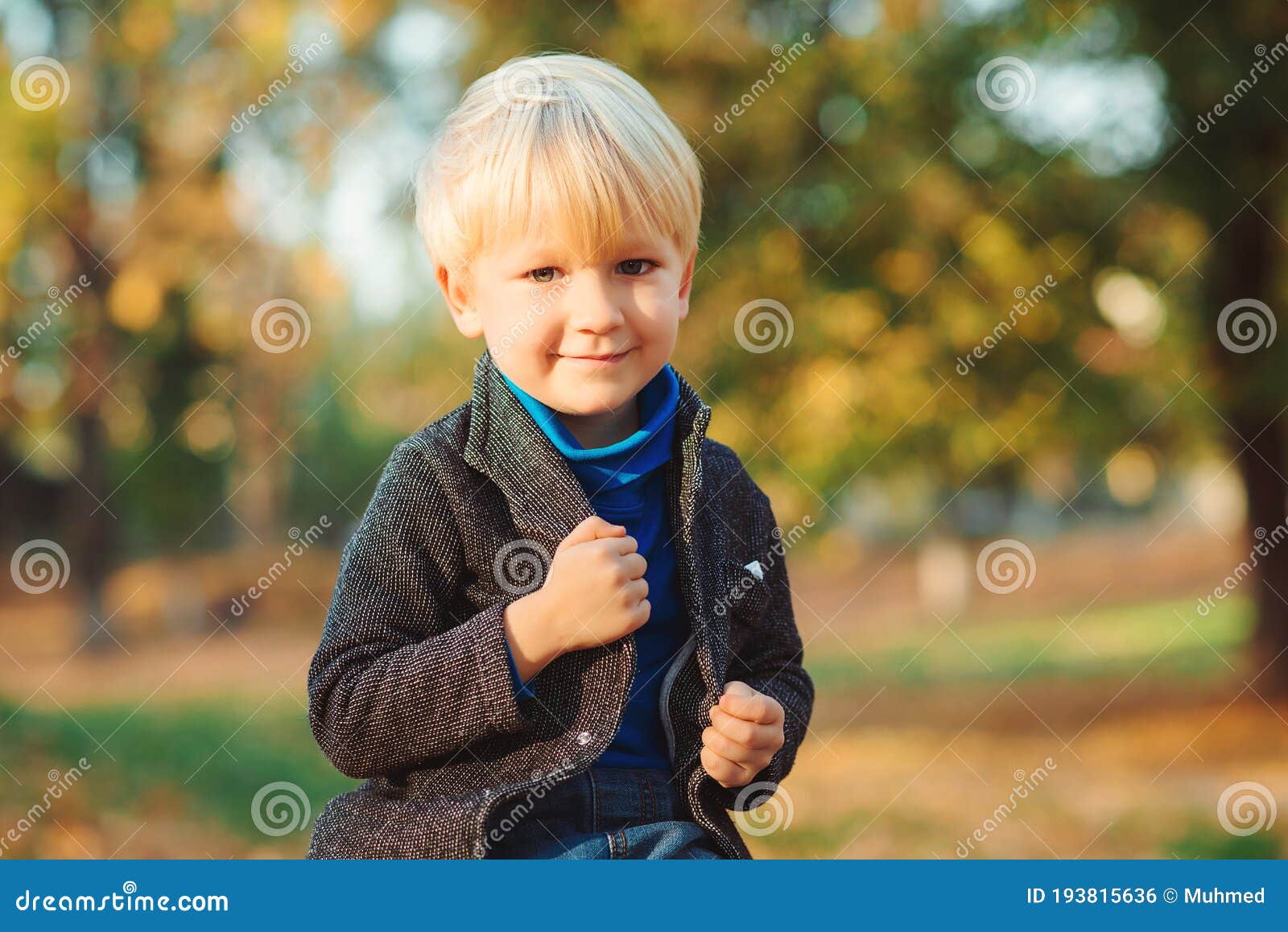Stylish Happy Child on Autumn Nature. Handsome Boy with Modern Hairstyle  Stock Photo - Image of october, handsome: 193815636