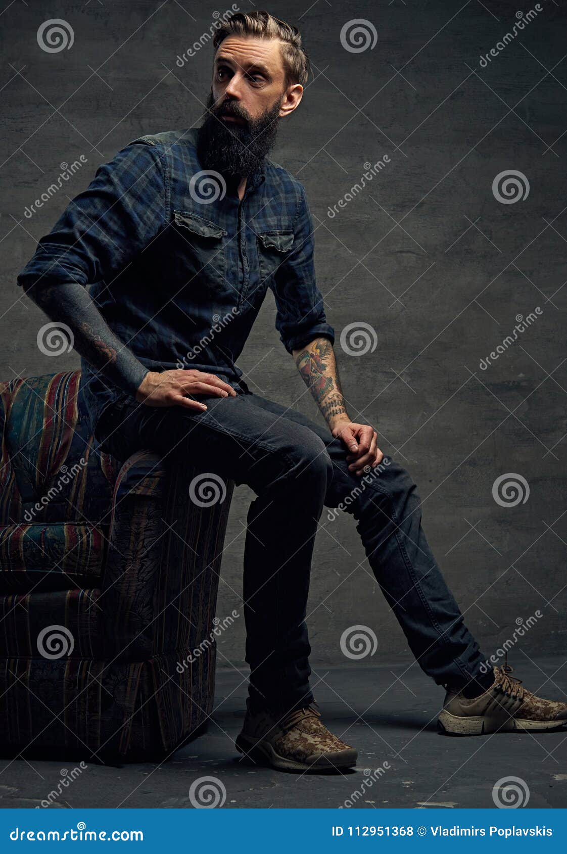 Bearded Male Sits On A Chair. Stock Photo - Image of tattoo, modern ...