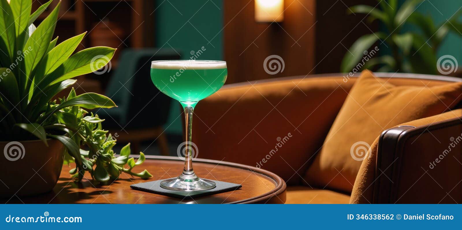 a stylish image featuring a vibrant cocktailfilled glass against a luxurious green backdrop