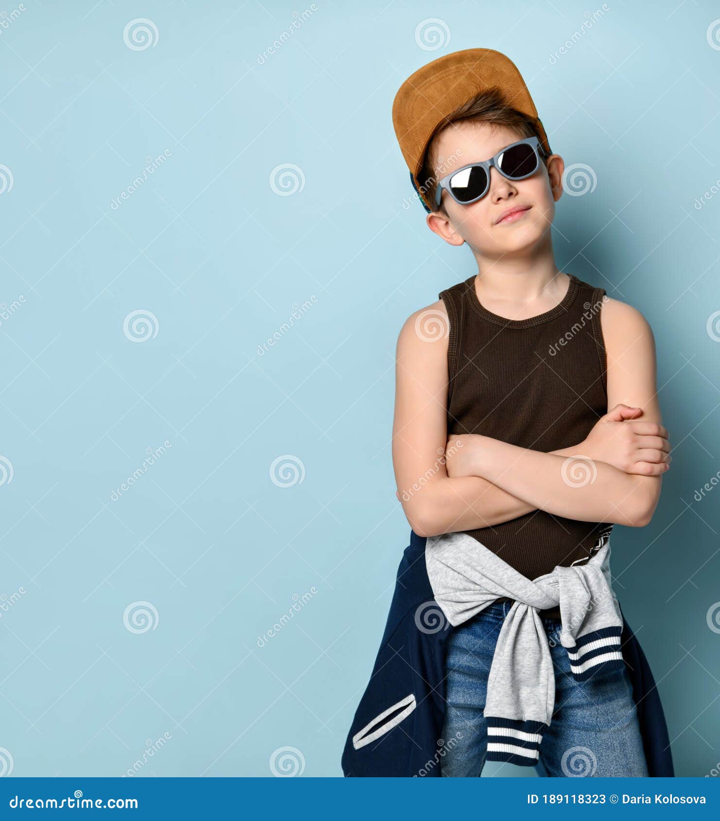 Stylish Kid in Sunglasses, Cap, Jeans, Shirt and Sports Jacket Around ...