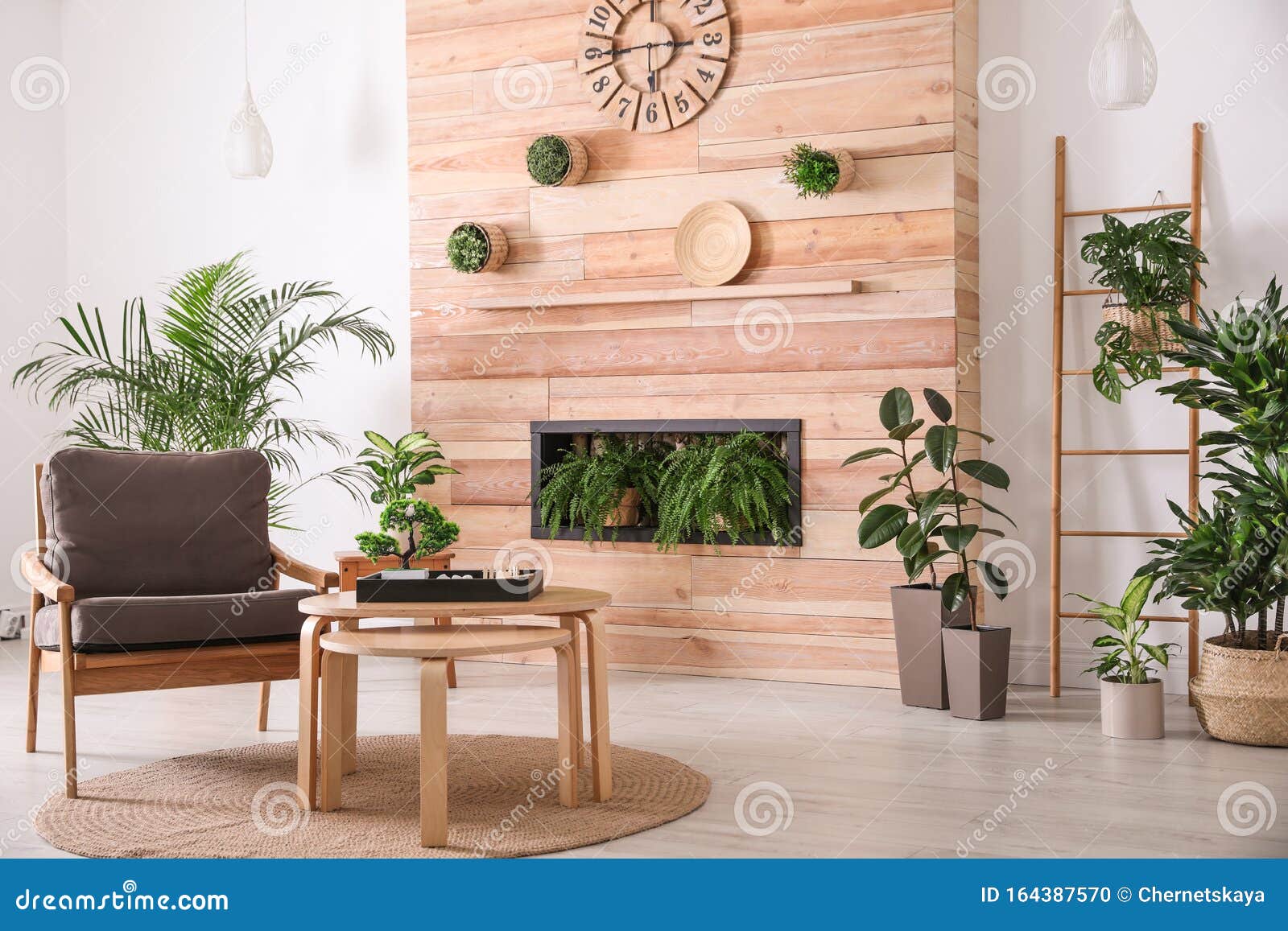 Stylish Living Room Interior with Armchair, Plants and Miniature ...