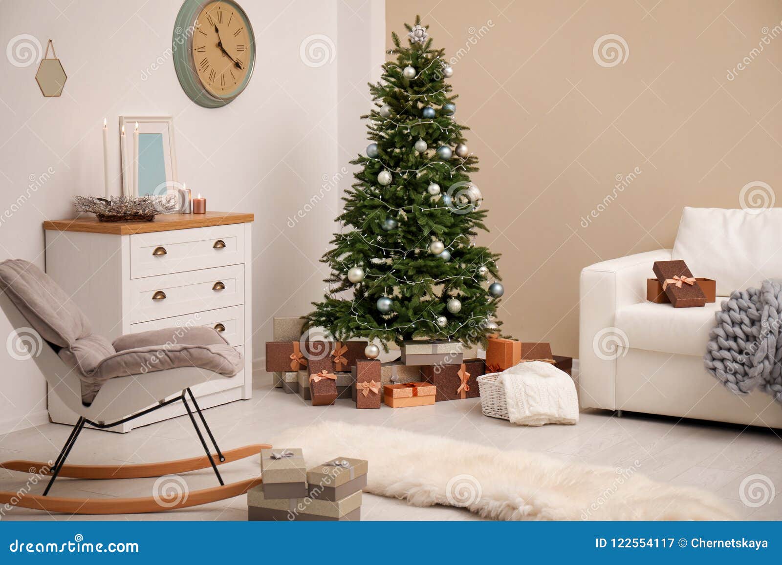 Stylish living room interior with decorated Christmas tree