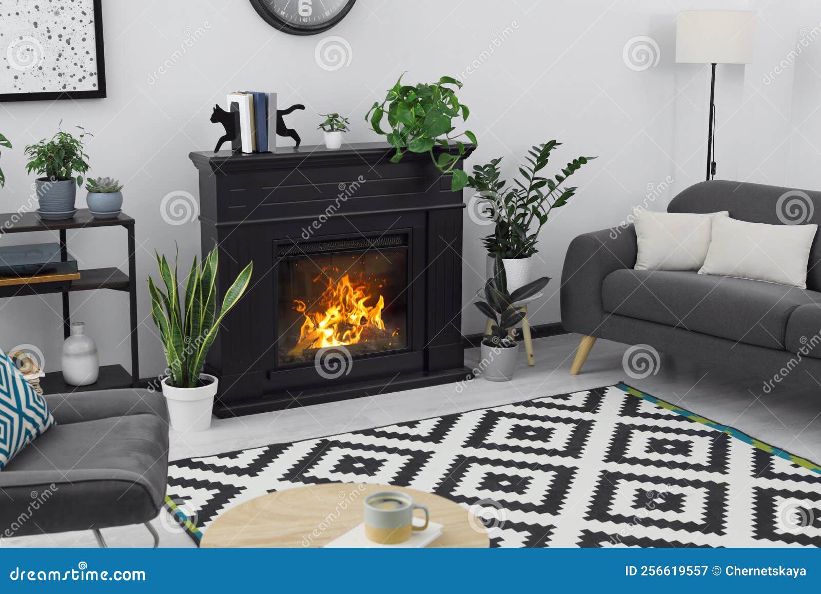 Stylish Living Room Interior with Fireplace and Comfortable Sofa Stock