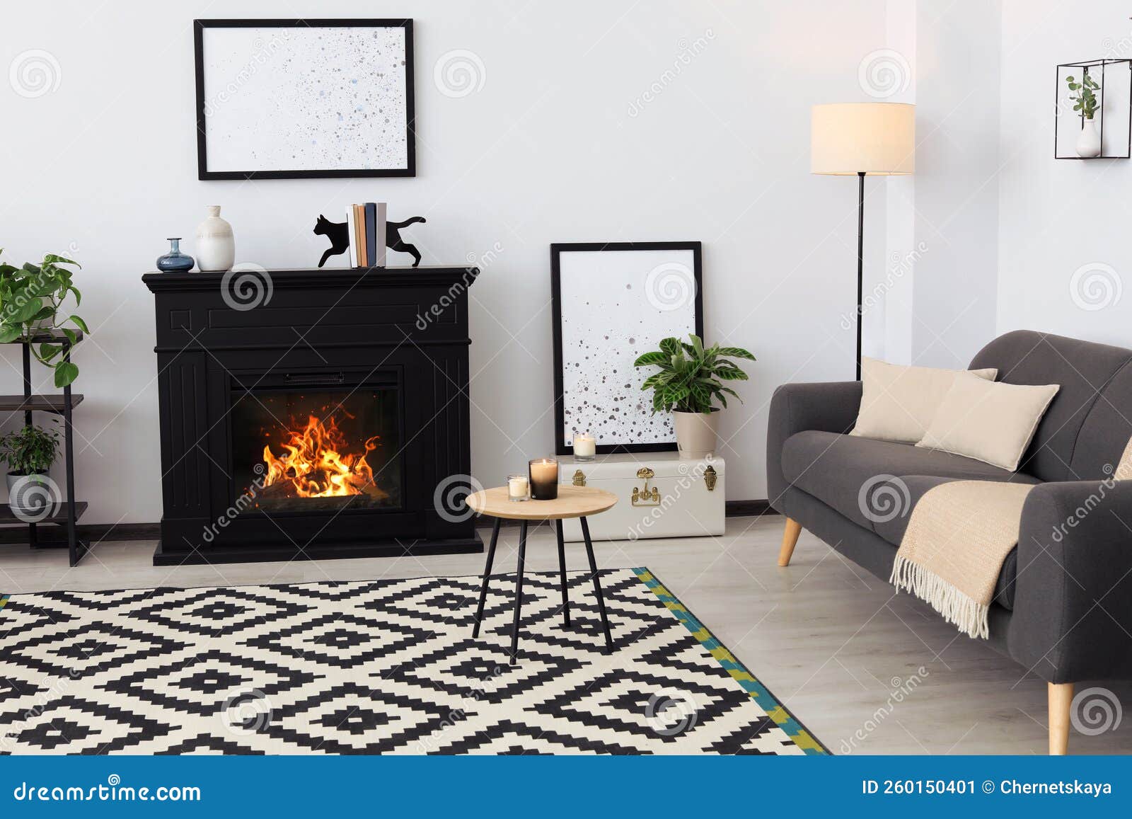 Stylish Living Room Interior with Fireplace and Comfortable Sofa Stock