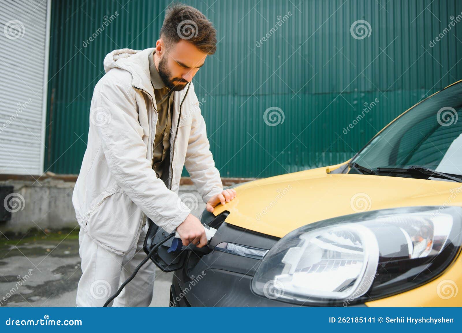 Stylish Man Inserts the Charging Cable into the Socket of Electric Car Stock Image Image of
