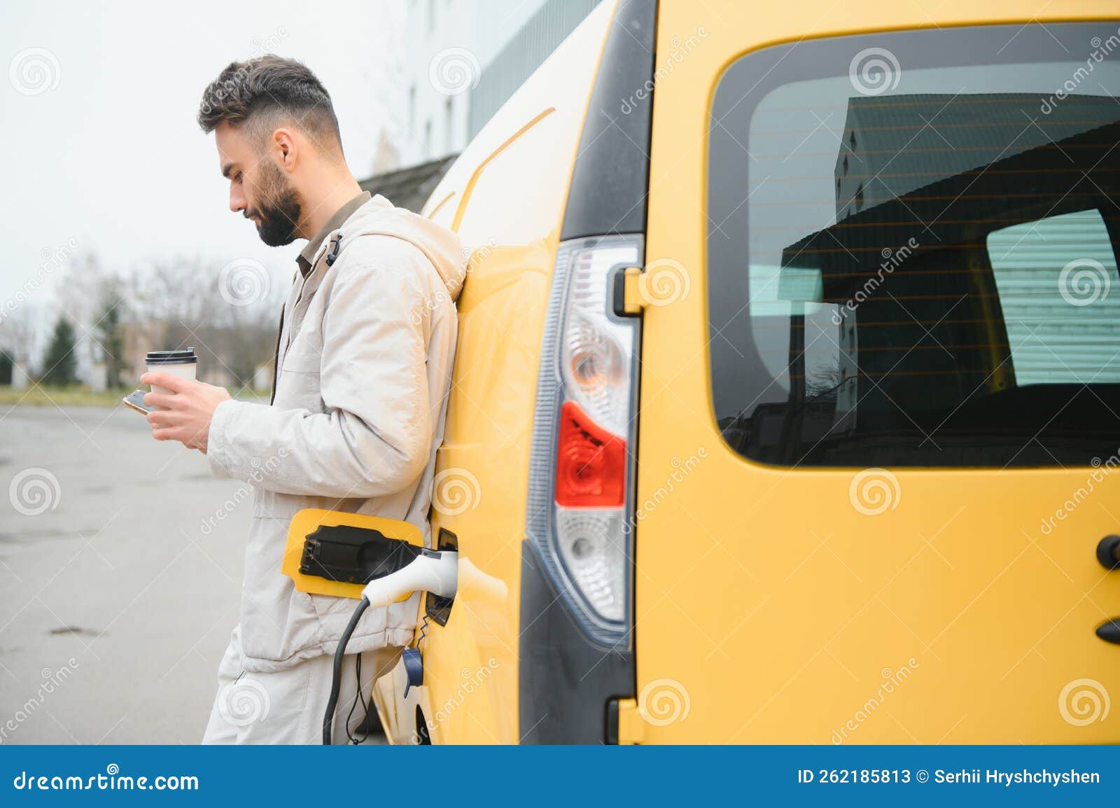 Stylish Man Inserts the Charging Cable into the Socket of Electric Car Stock Image Image of