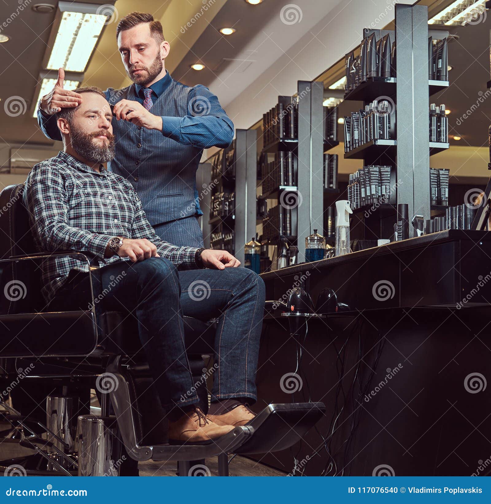 A Stylish Master Barber Does a Haircut To the Client. Men`s Haircut in ...