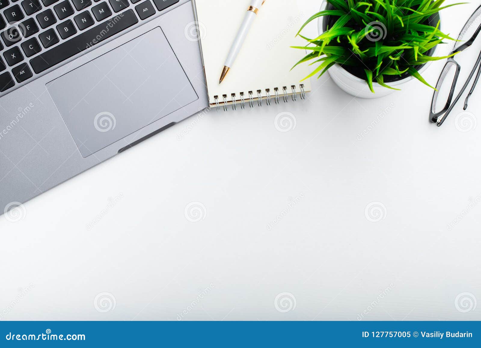 stylish office table desk. workspace with laptop, diary, succulent on white background. flat lay, top view with copy space for tex