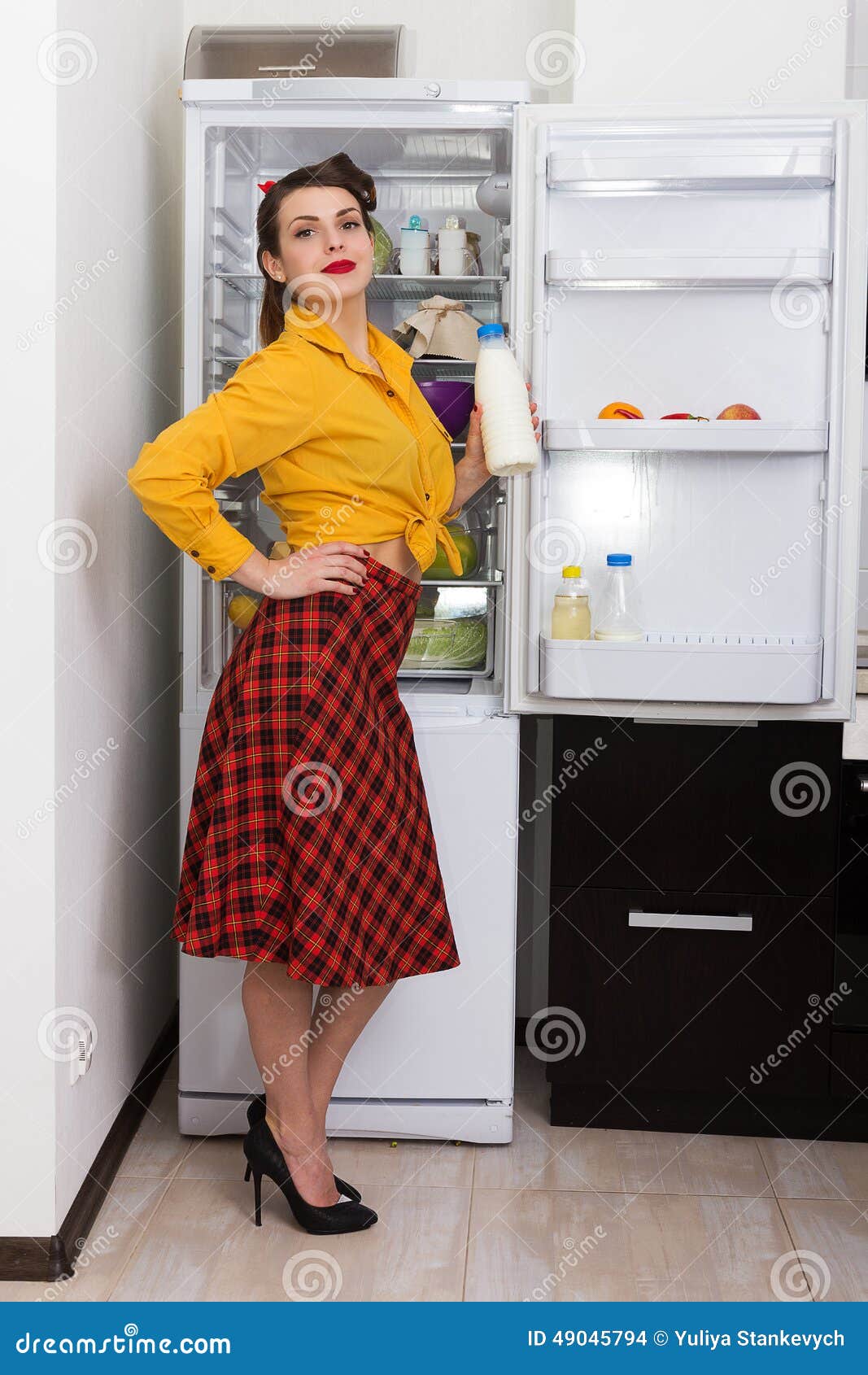 Stylish pinup housewife stock photo. Image of skirt 49045794