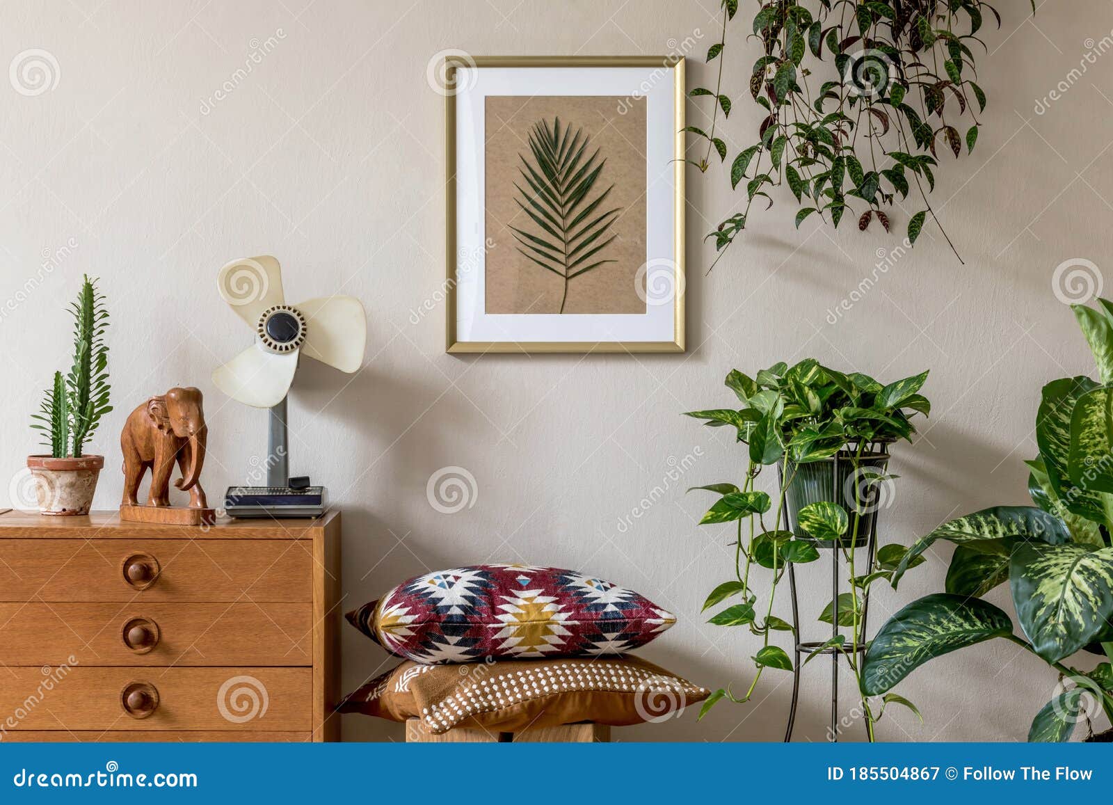 stylish retro home staging of living room with gold mock up poster frame.