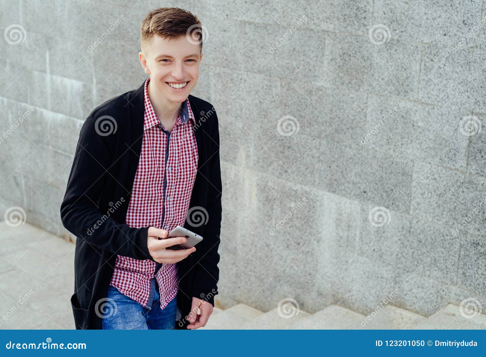 Stylish Smiling Young Man in Plaid Shirt and Jeans. Stock Photo - Image ...