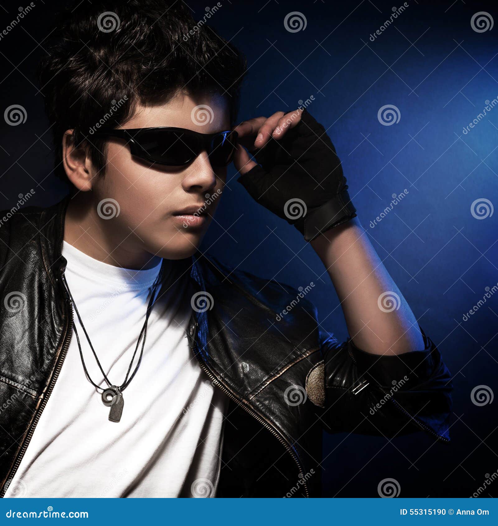 https://thumbs.dreamstime.com/z/stylish-teen-boy-portrait-beautiful-wearing-sunglasses-leather-jacket-over-blue-background-fashion-accessories-teenager-55315190.jpg