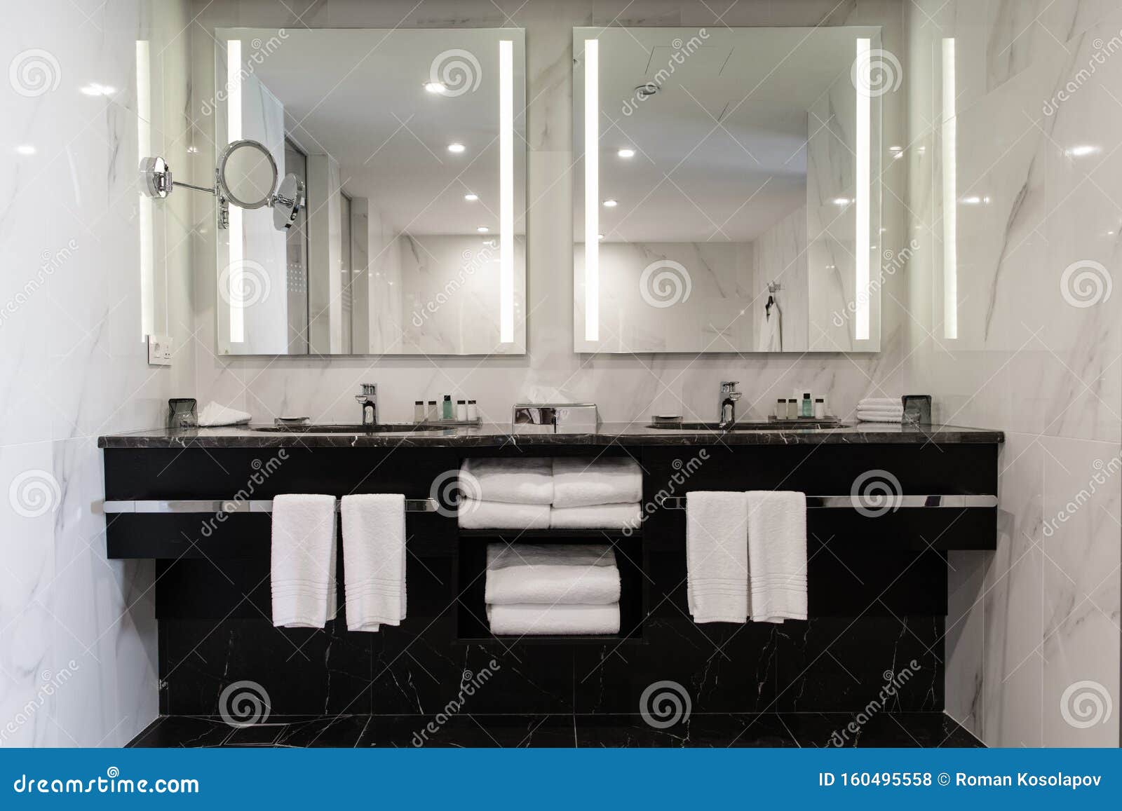 stylish twin bathroom with two sinks and mirror.