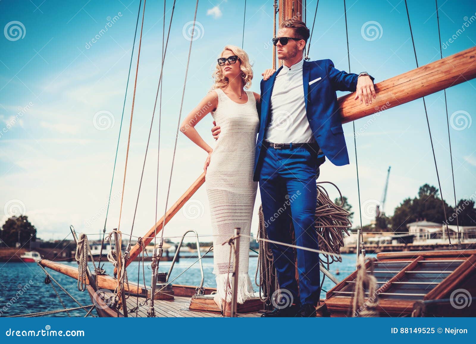 stylish wealthy couple on a luxury yacht