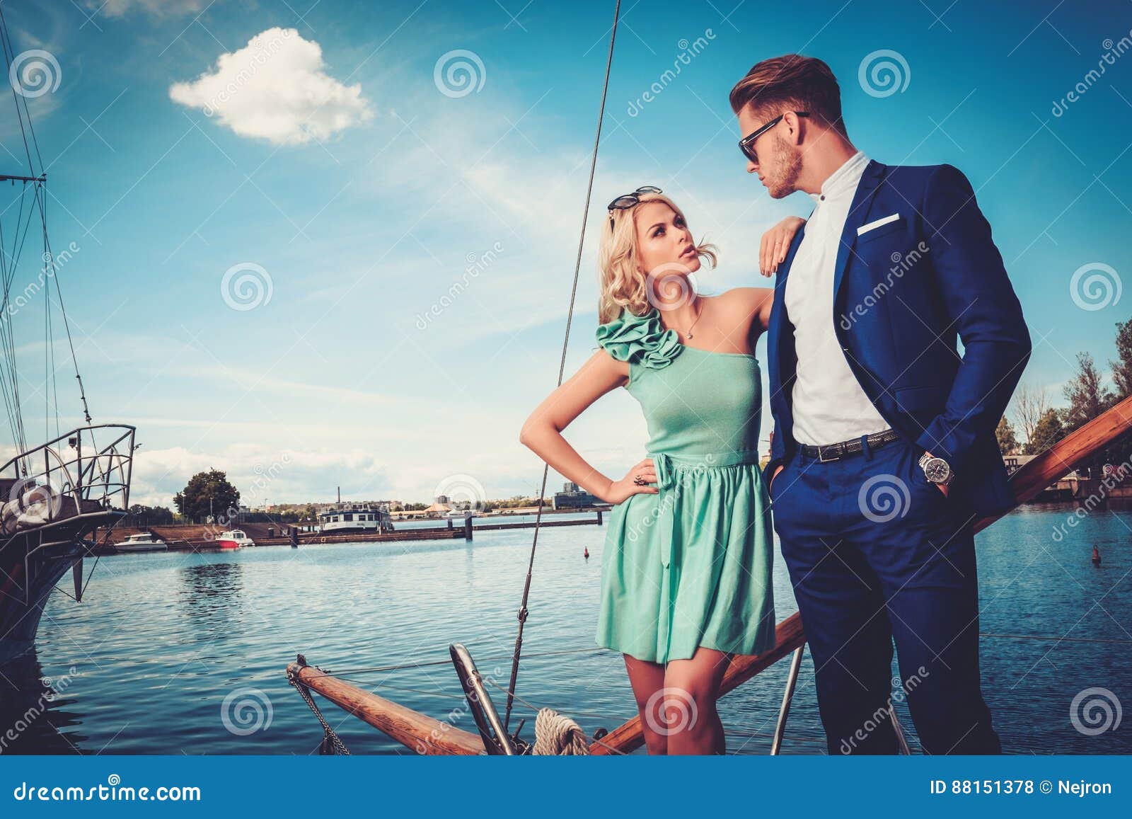 stylish wealthy couple on a luxury yacht