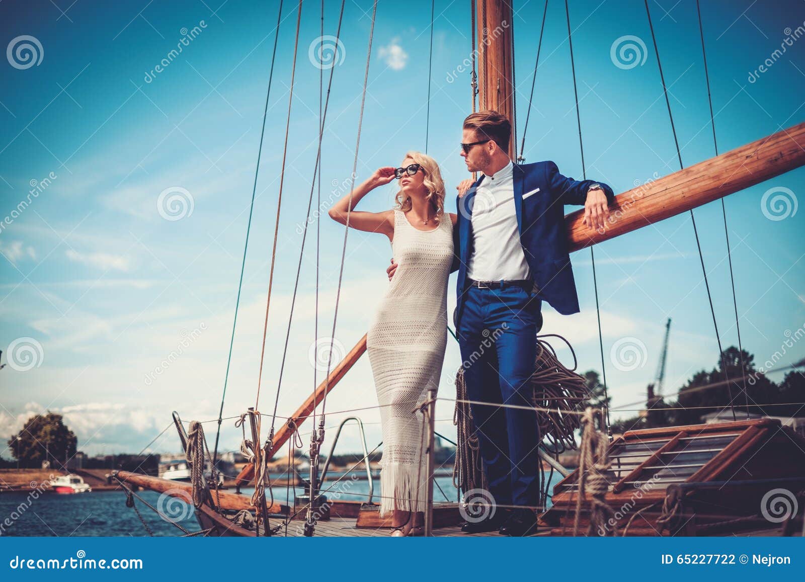 stylish wealthy couple on a yacht