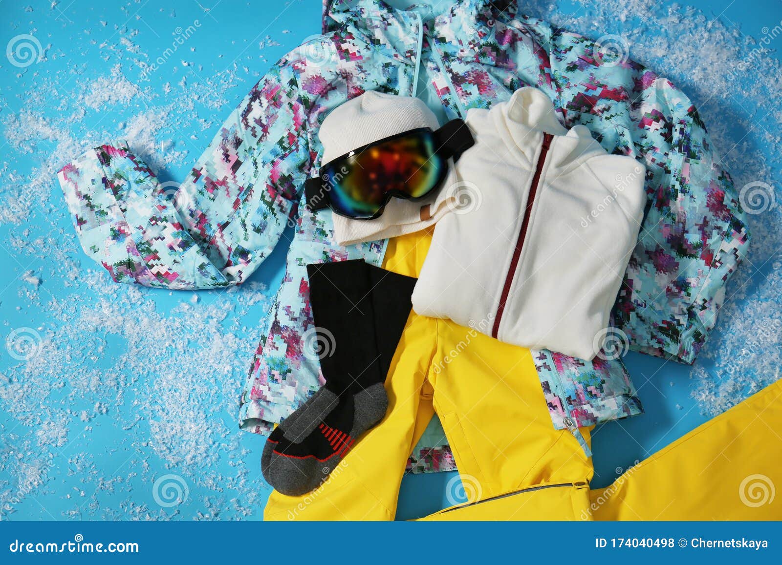Stylish Winter Sport Clothes on Blue Background, Flat Lay Stock Photo
