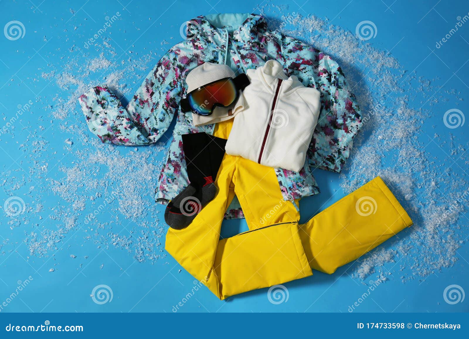 Stylish Winter Sport Clothes on Light Blue Background, Flat Lay Stock