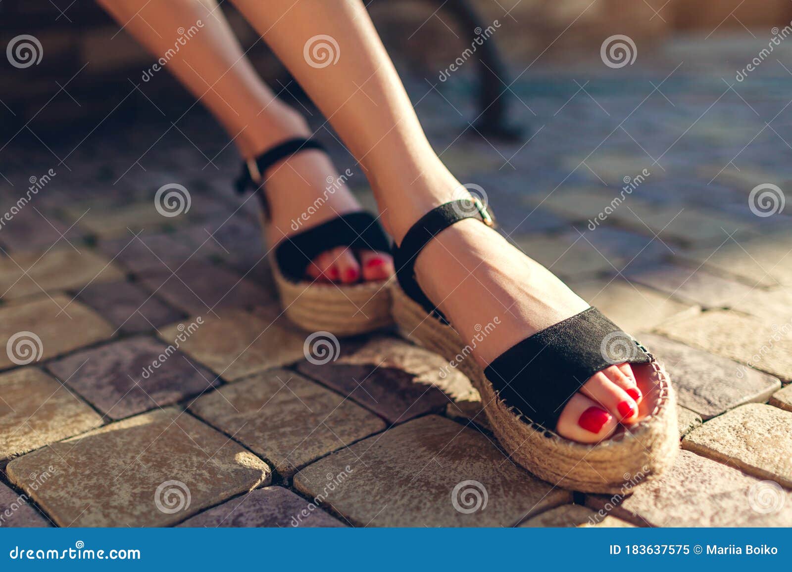 Stylish Woman Wearing Black Summer Shoes with Straw Sole Outdoors ...