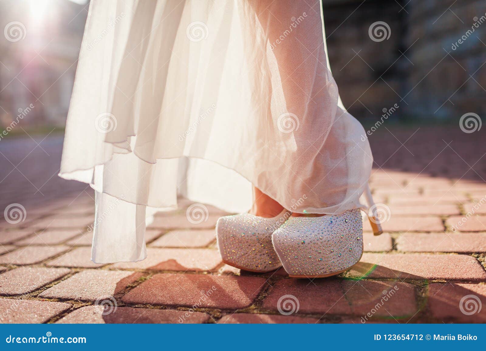 Stylish Woman Wearing High Heeled Shoes and White Dress Outdoors ...