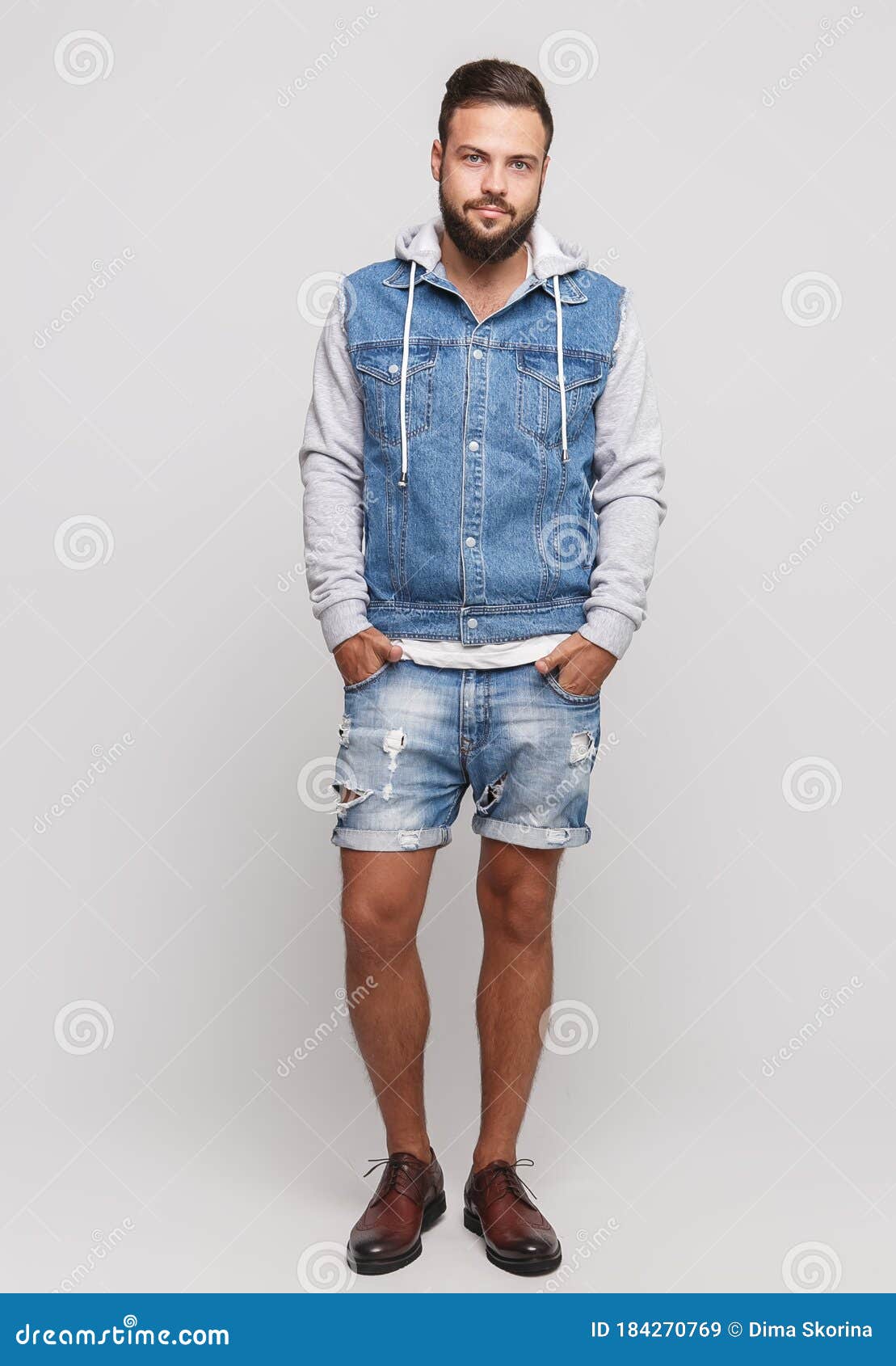 Young Man In A Denim Jacket And White Tshirt Posing On Nature Stock Photo  Picture And Royalty Free Image Image 82074561