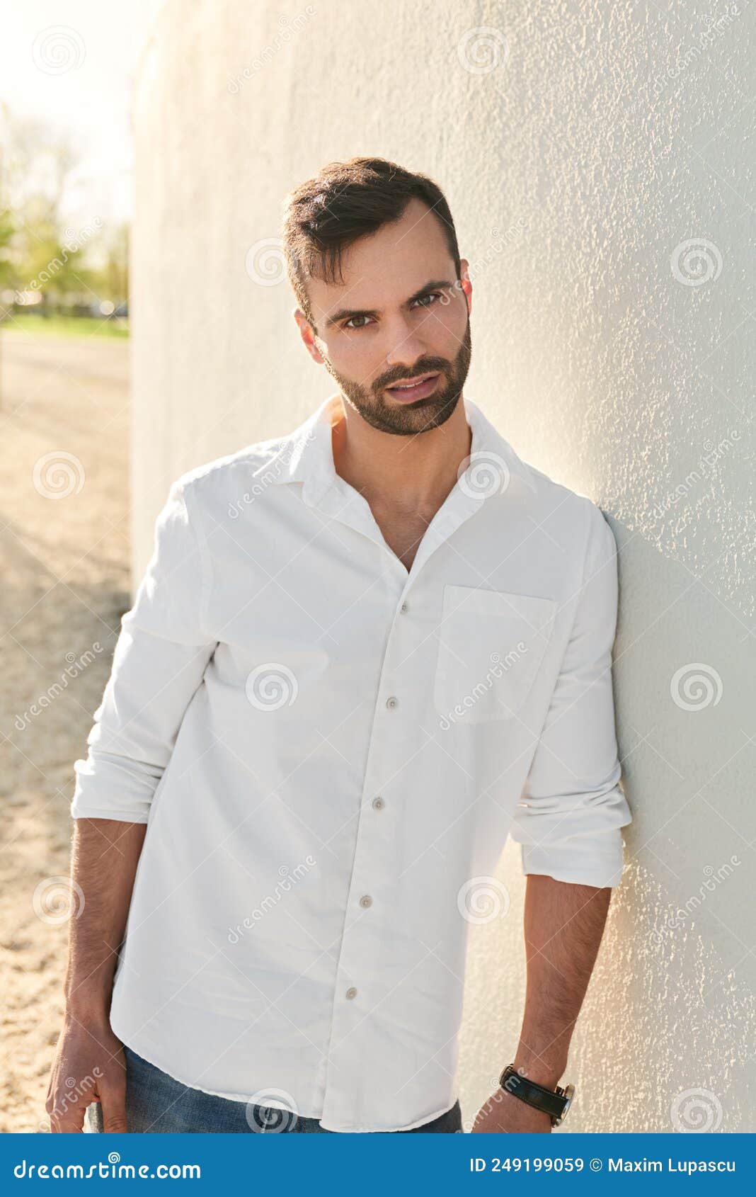 Stylish Young Ethnic Male Leaning on Wall and Looking at Camera Stock ...