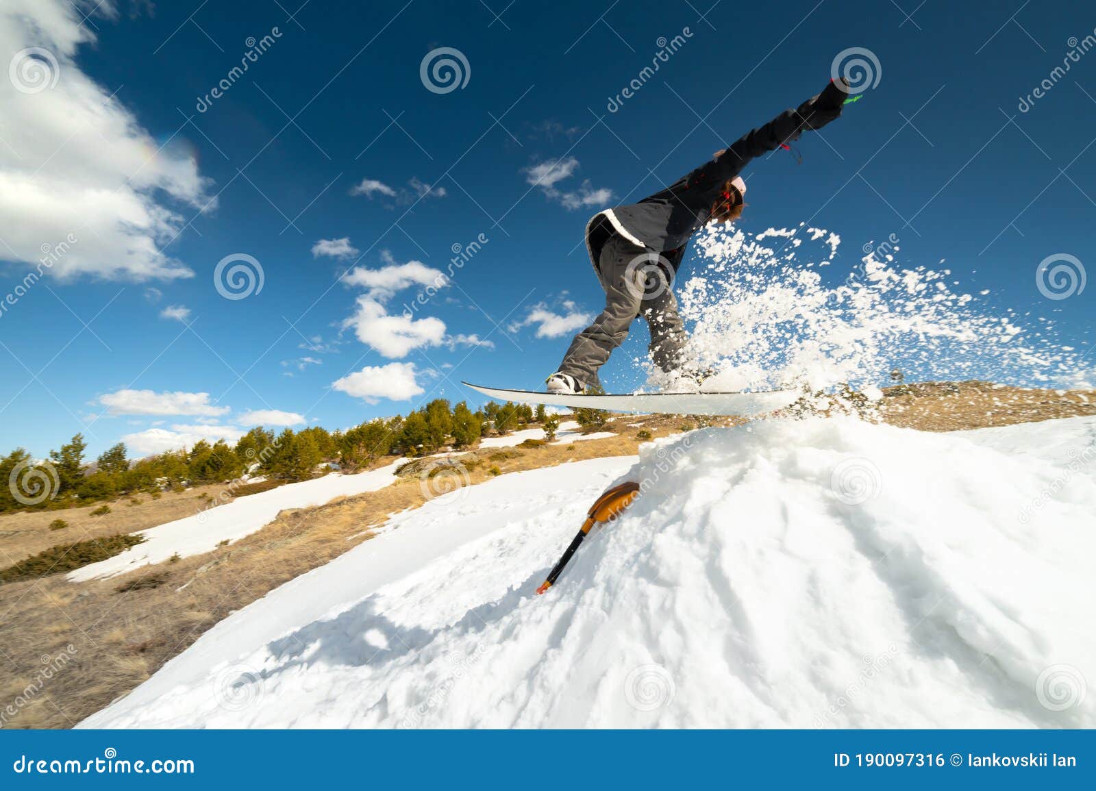 Stylish Young Girl Snowboarder Does the Trick in Jumping from a Snow ...