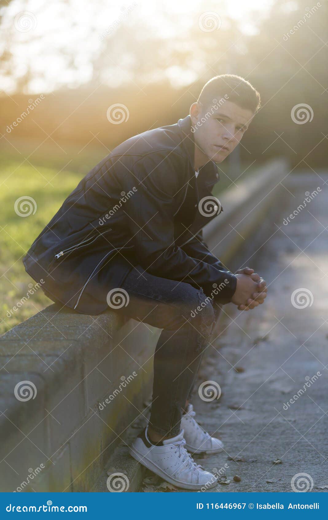 Stylish Young Man in Leather Jacket Looking at Camera, Sitting I Stock ...