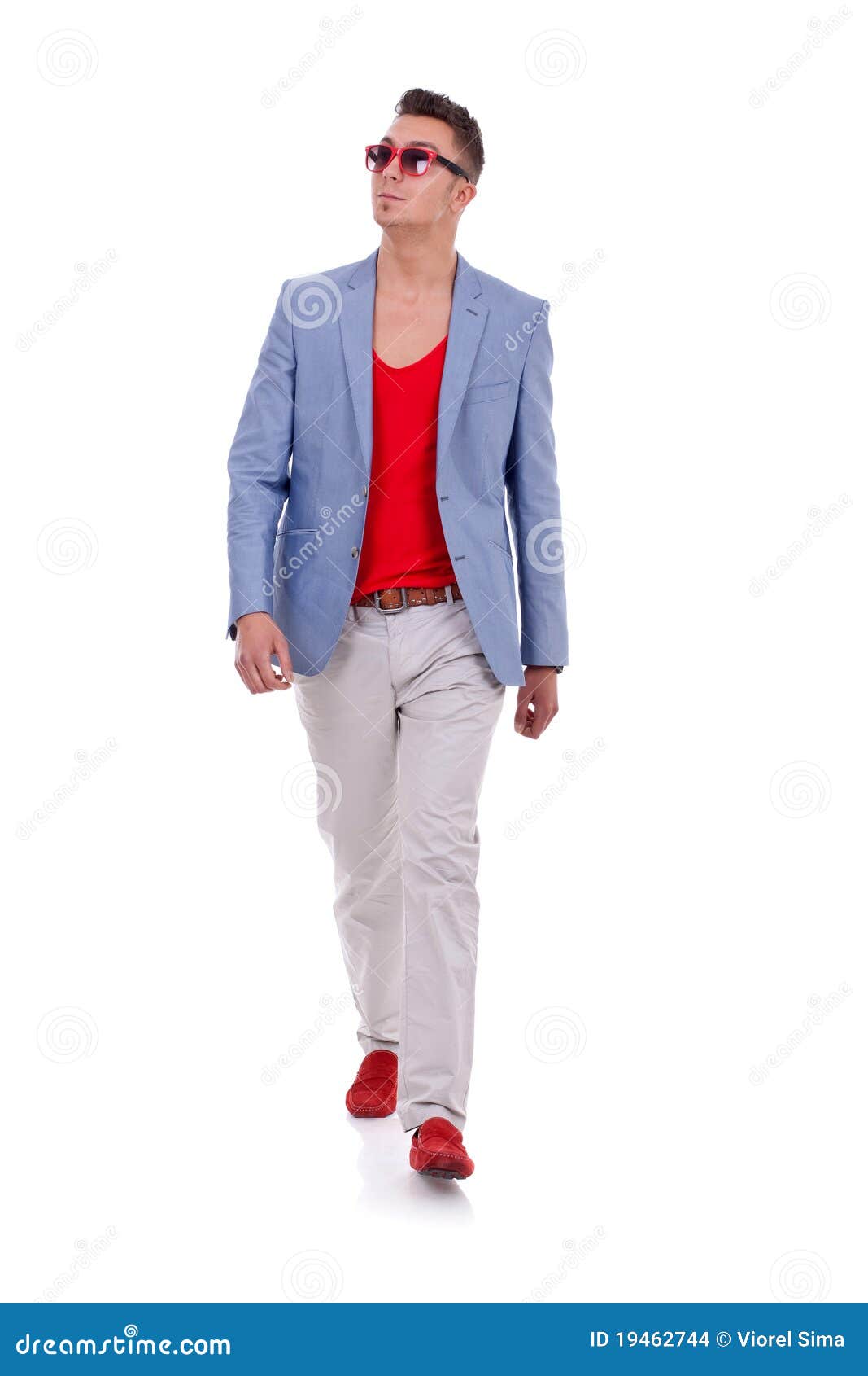 Stylish young man walking stock photo 