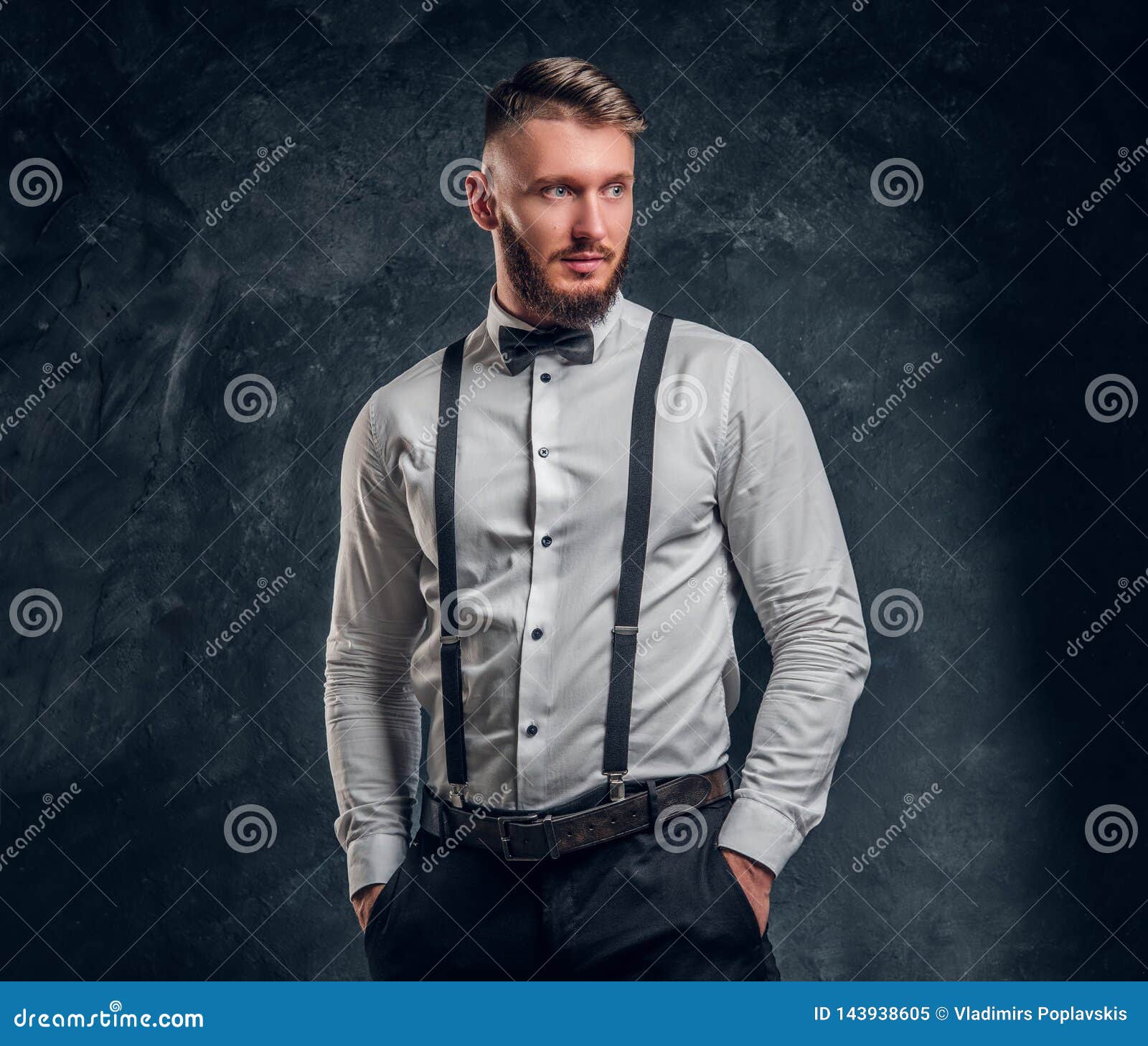 Stylishly Dressed Young Man In Shirt With Bow Tie And Suspenders ...