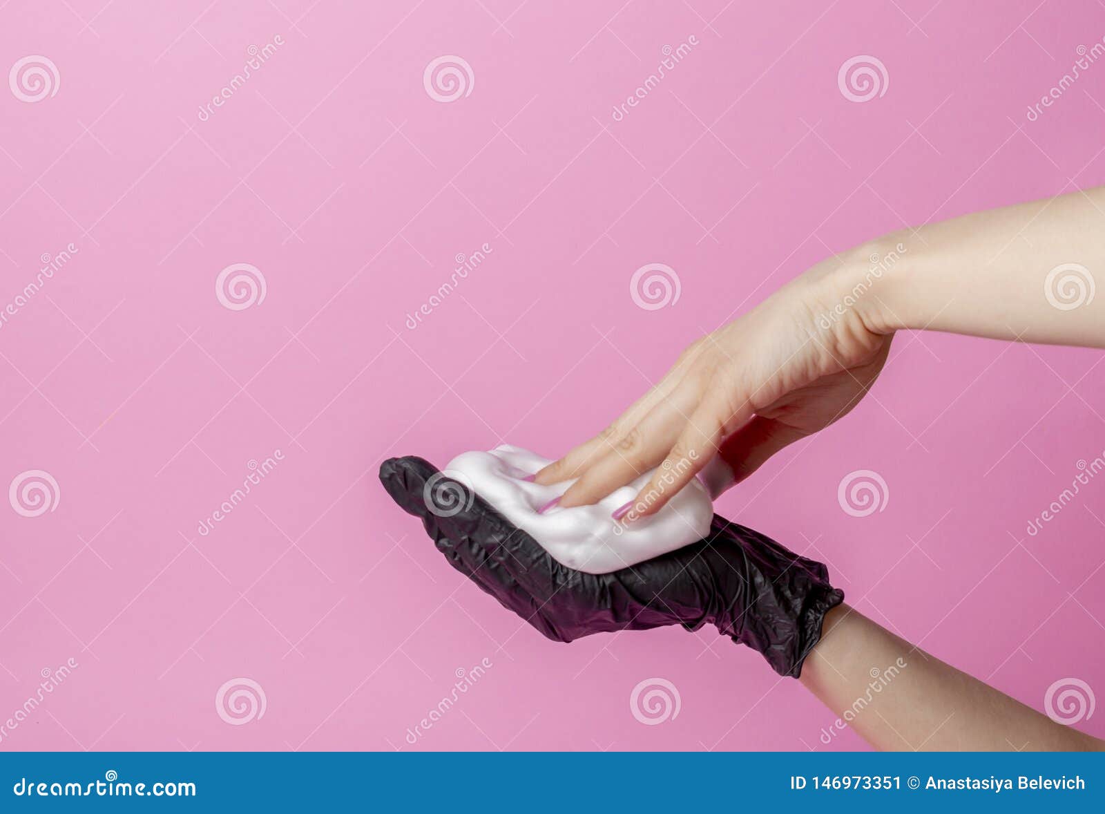 The Stylist S Hand In A Black Glove Holds A Hairbrush The Second