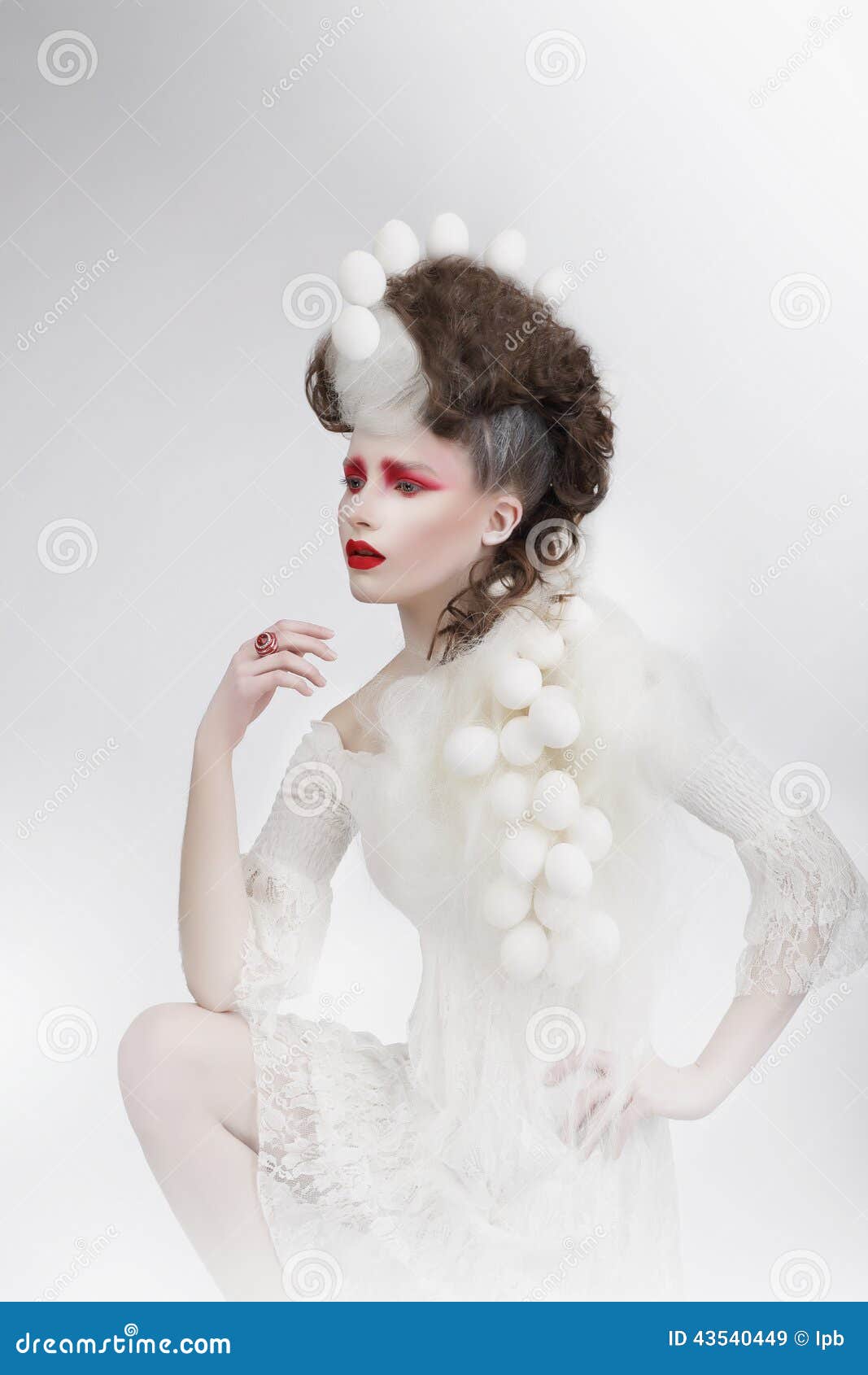 stylization. woman with eggshells and art fancy makeup. fantasy