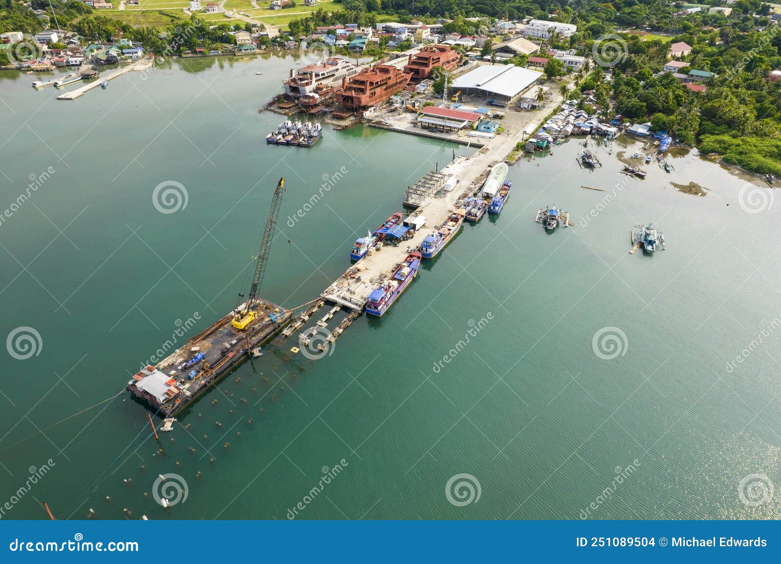 sual, pangasinan, philippines - a fishing seaport under construction at the town of sual. josefa slipways, and